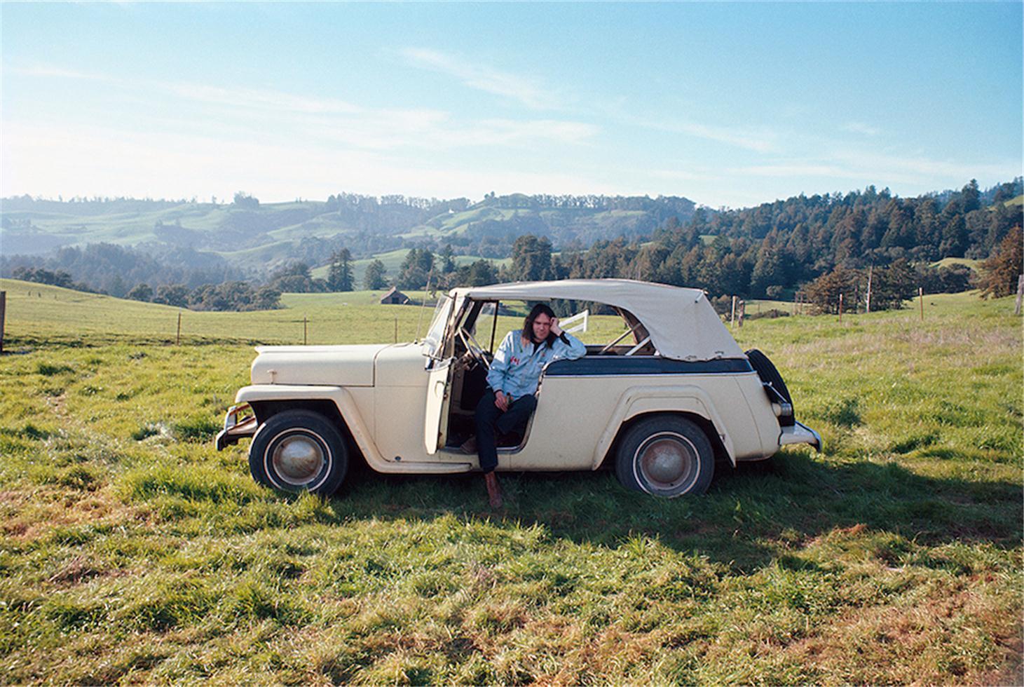 Joel Bernstein Color Photograph - Neil Young with Car