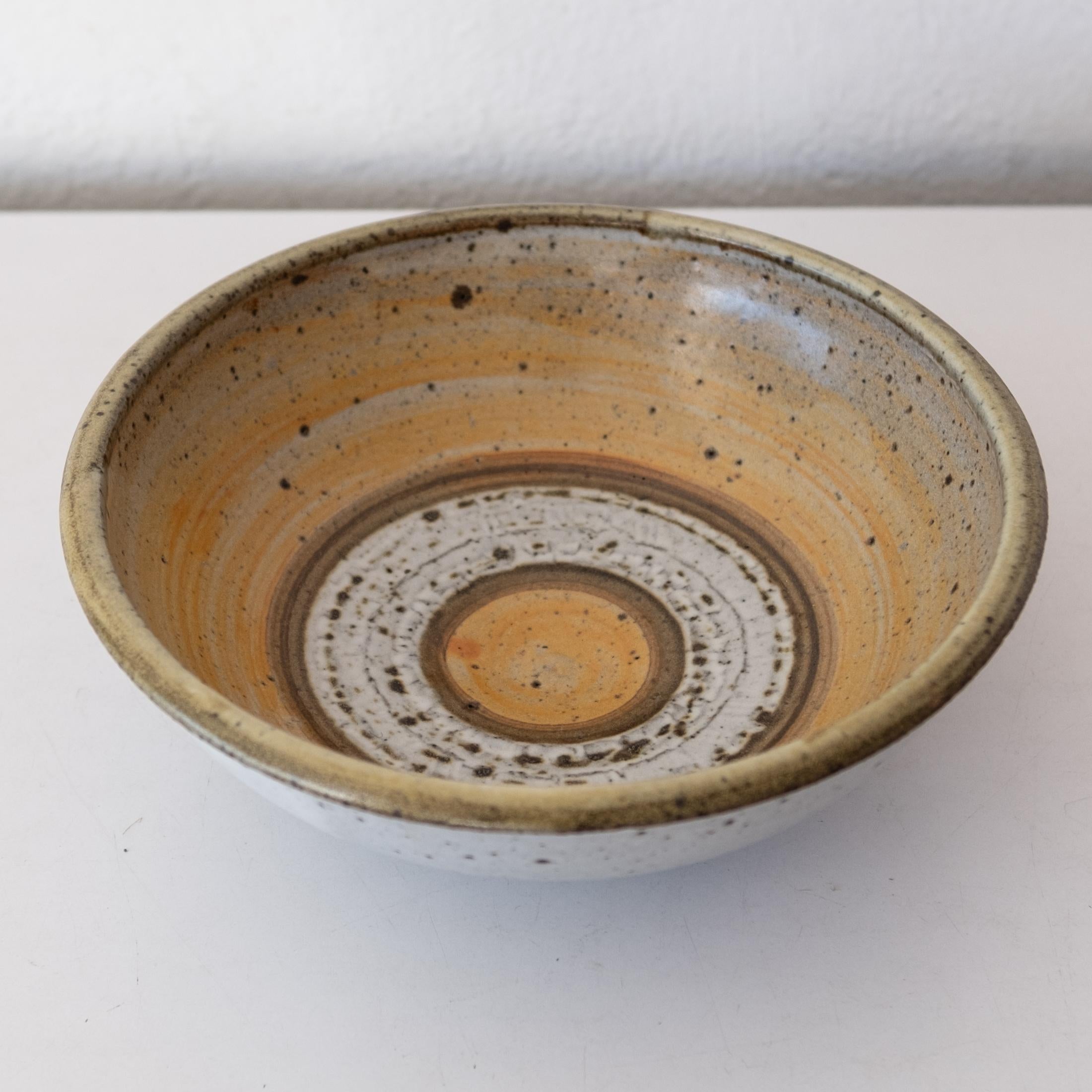 Stoneware bowl with wax resist decoration by California artist, Joel Edwards. 1960s

Joel Edwards. Los Angeles, CA. Studied at Otis Art Institute under Peter Voulkos. Creator of “Creative Crafts” Magazine, 1960-1964.

8.5 inches wide x 3 inches high