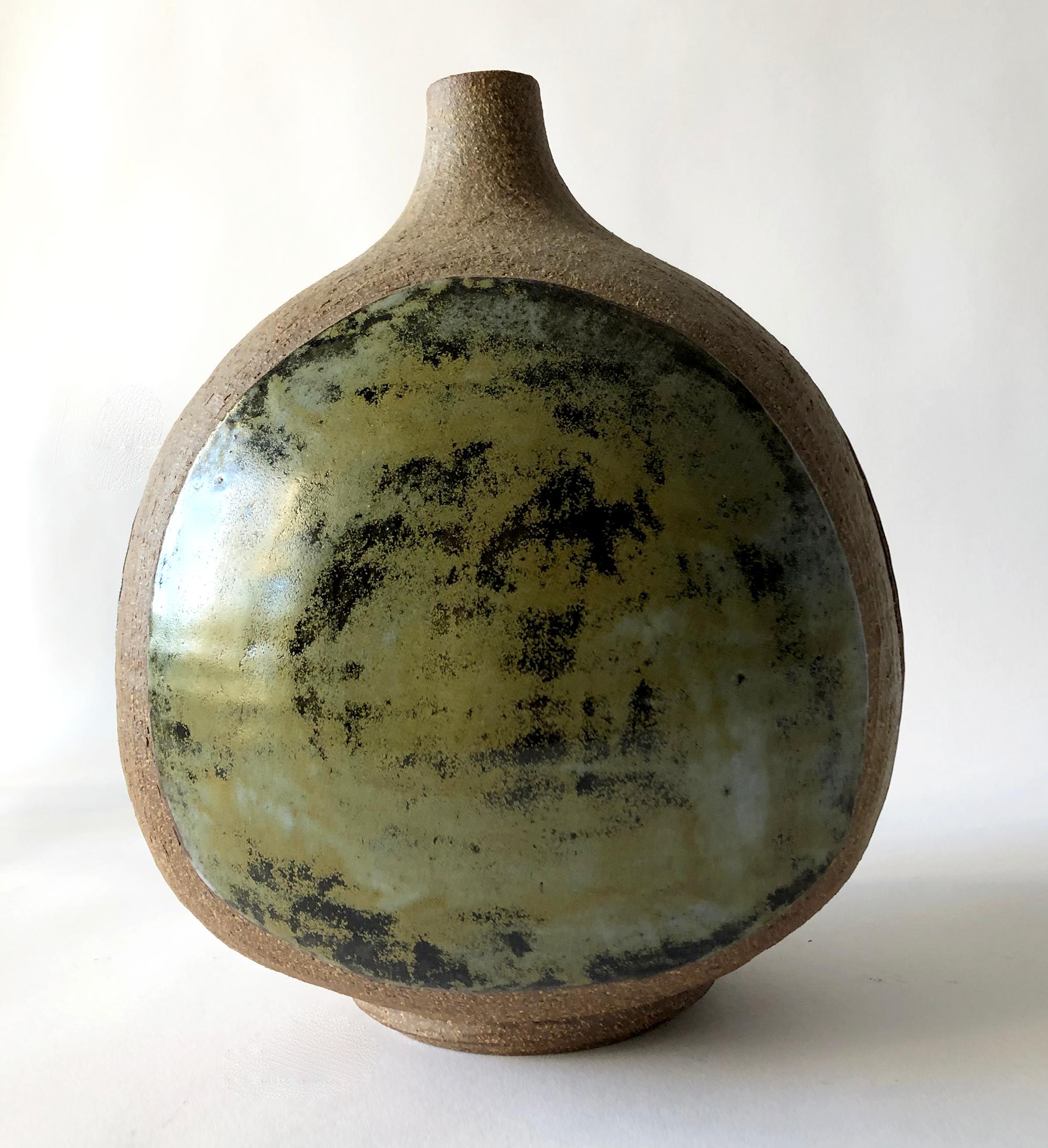 Three sided stoneware vase created by California studio potter Joel Edwards. Vase measures 9.5