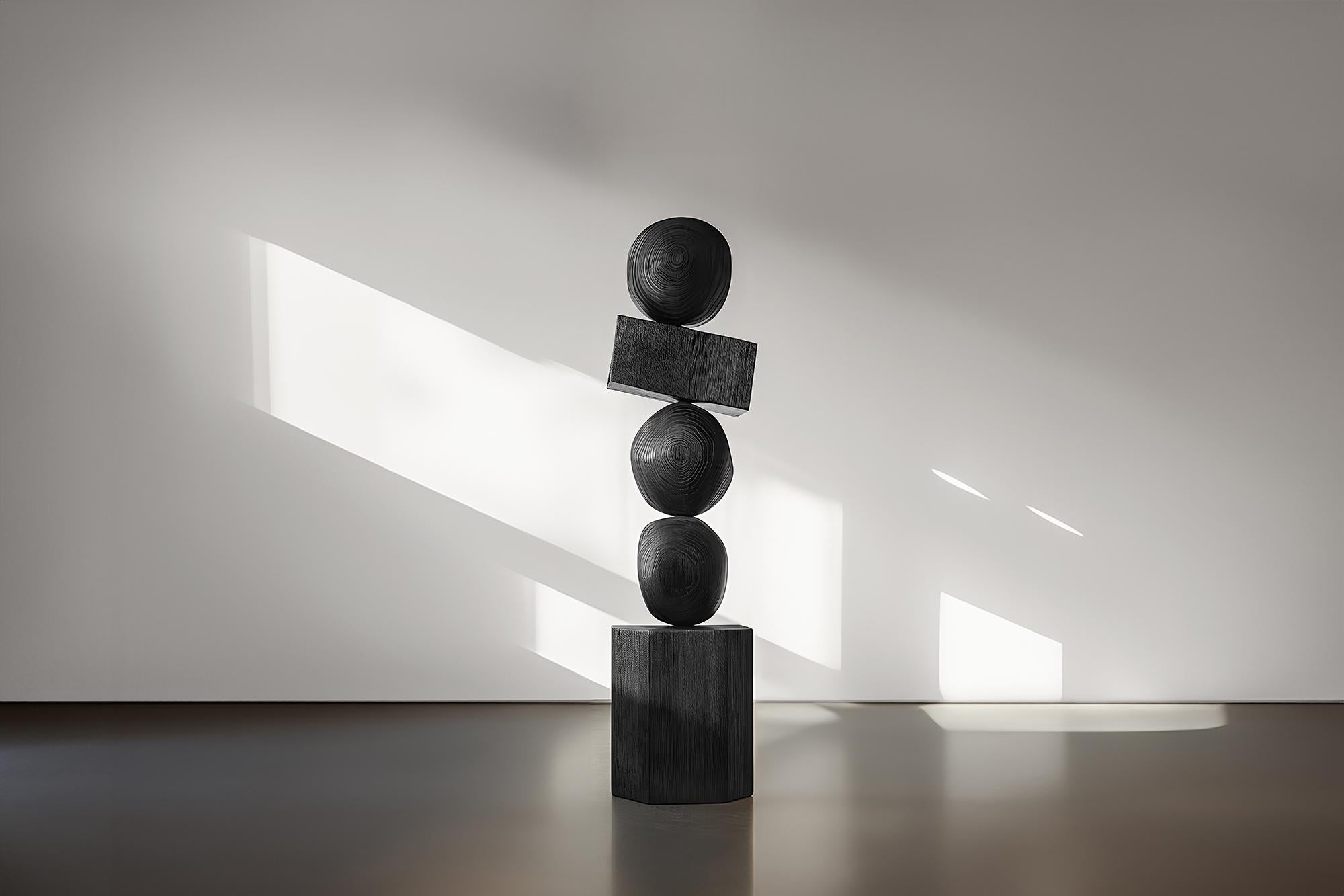 Joel Escalona's Sleek Dark Totem in Black Solid Wood, Still Stand No92
——

Joel Escalona's wooden standing sculptures are objects of raw beauty and serene grace. Each one is a testament to the power of the material, with smooth curves that flow into