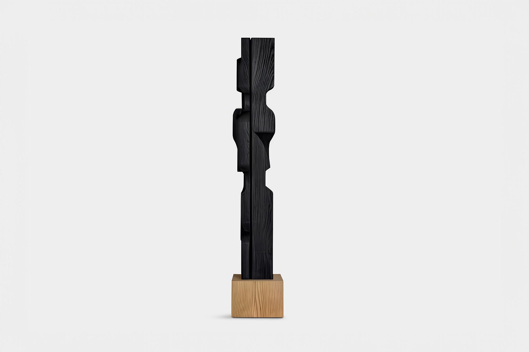 La force invisible de Joel Escalona n°49 : sculpture en bois massif, table d'art
---
Cette sculpture monolithique, conçue par l'artiste talentueux Joel Escalona, est un exemple impressionnant de la beauté de l'artisanat. Réalisée à la main et à la