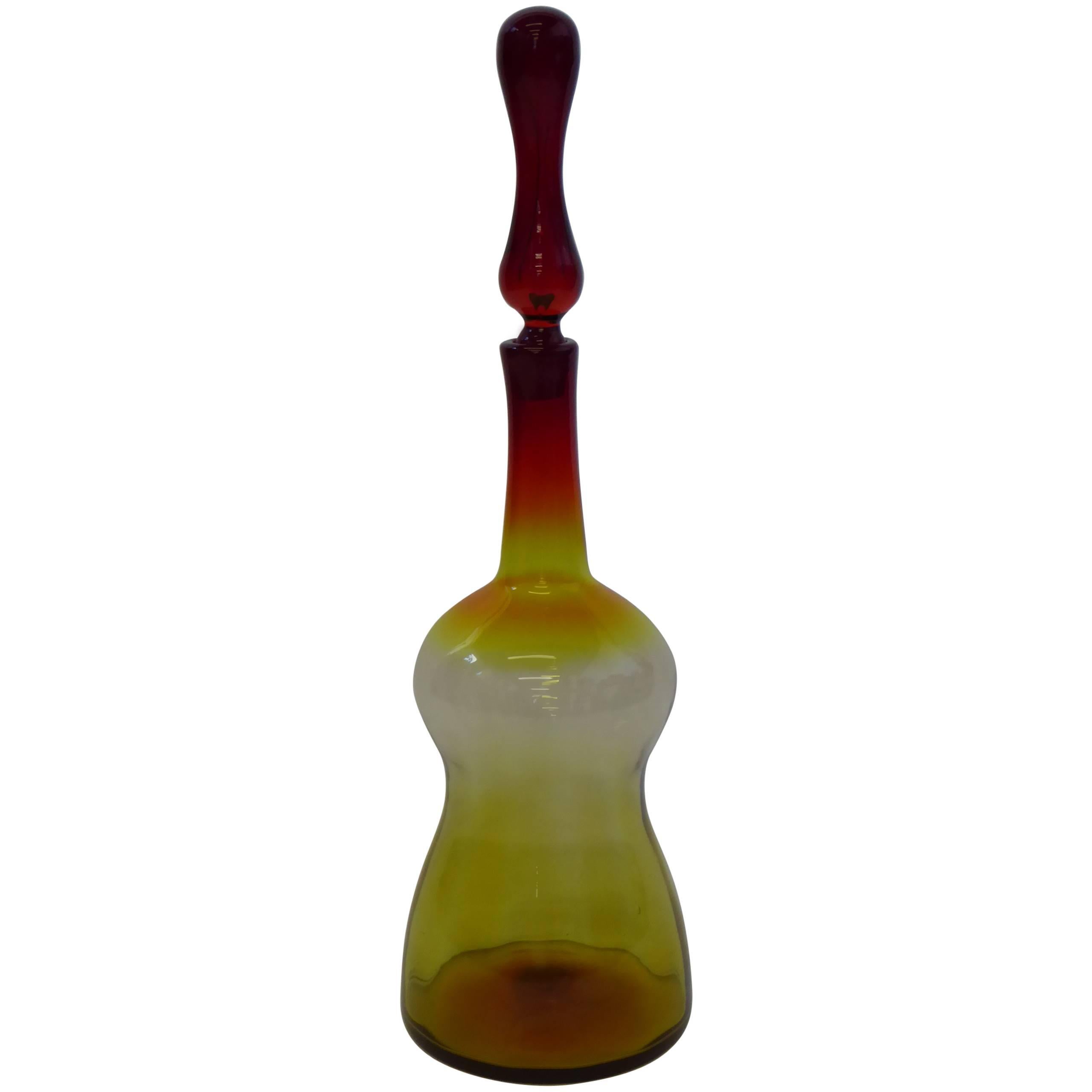 REDUCED FROM $650....Wonderful and large mid-century blown glass floor decanter by Joel Myers for Blenko of West Virginia. In mixed color Amberina, called Tangerine by Blenko, which is red melding into an orange yellow tone.   Very elegant and eye