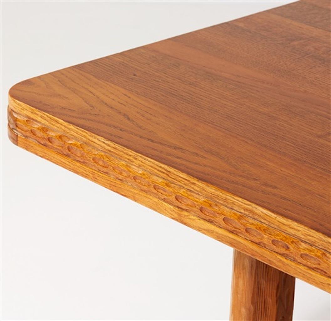 Early Scandinavian Modern library table by Swedish architect and designer Joel Norborg.
Executed in oak, pine and iron rivets. Hand carved & sculpted relief details to the slab and legs.
The table was manufactured, circa 1910.
Norborg (1880-1971)