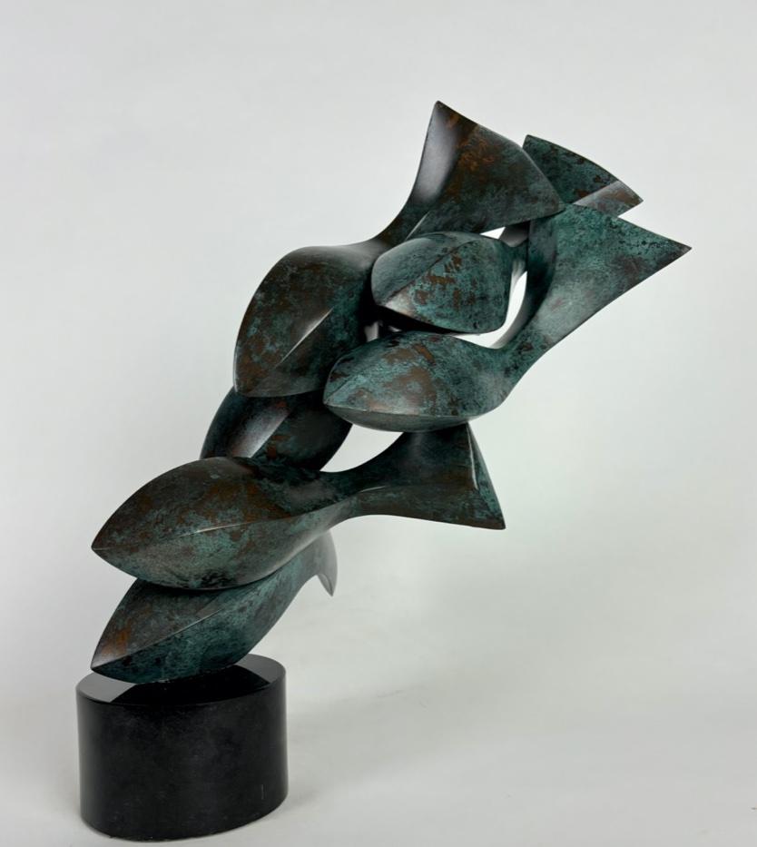 Medium: basswood, bronze, granite

As an artist I strive to create elegant sculptures that capture the true essence of the subject matter. Form, line and surface are used as the visual language. The figure is abstracted to a minimalist form, void of
