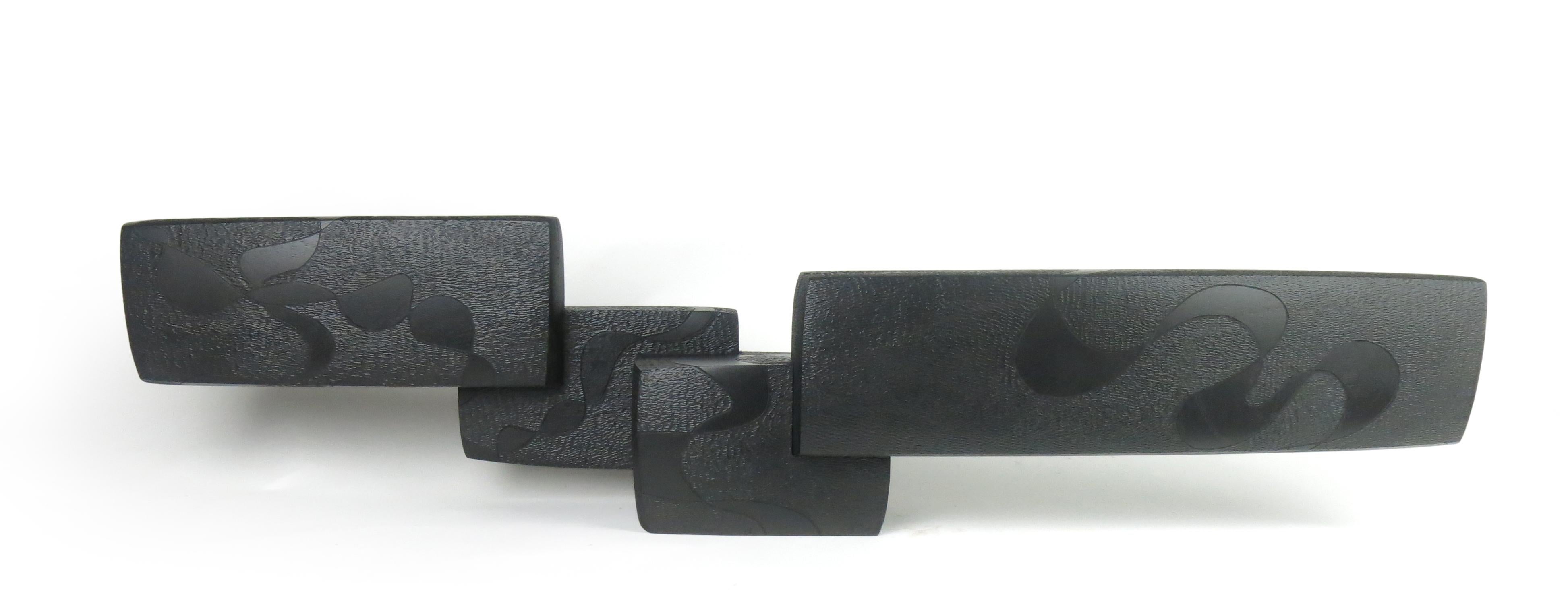 Medium: tinted mahogany and lacquer

As an artist I strive to create elegant sculptures that capture the true essence of the subject matter. Form, line and surface are used as the visual language. The figure is abstracted to a minimalist form, void