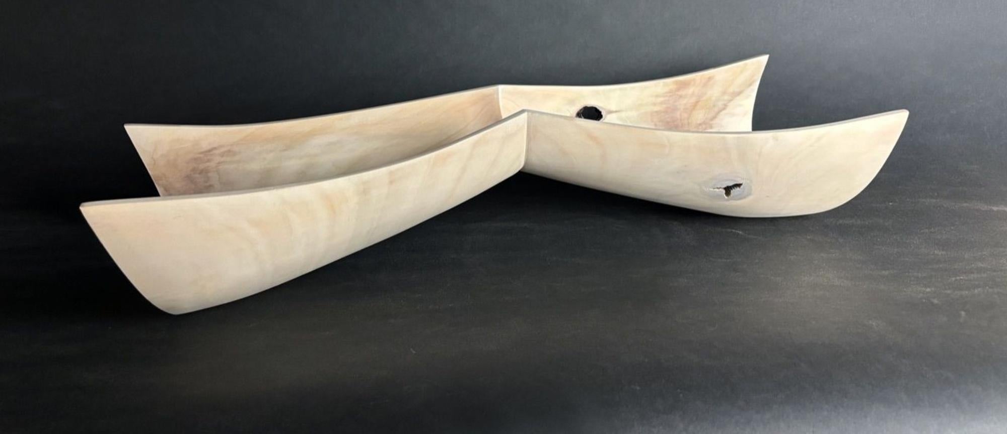 Medium: Bleached poplar

As an artist I strive to create elegant sculptures that capture the true essence of the subject matter. Form, line and surface are used as the visual language. The figure is abstracted to a minimalist form, void of any