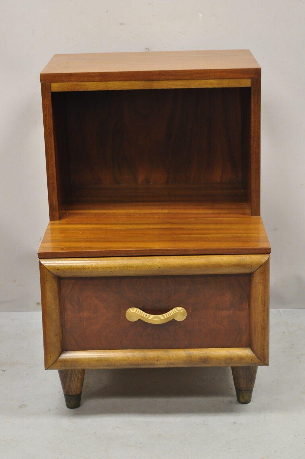 Joerns Bros Mid Century Art Deco Walnut Step Up Nightstand Side Table. Item features beautiful wood grain, original label, 1 dovetailed drawer, tapered legs, quality American craftsmanship, great style and form. Circa early to mid 20th century.