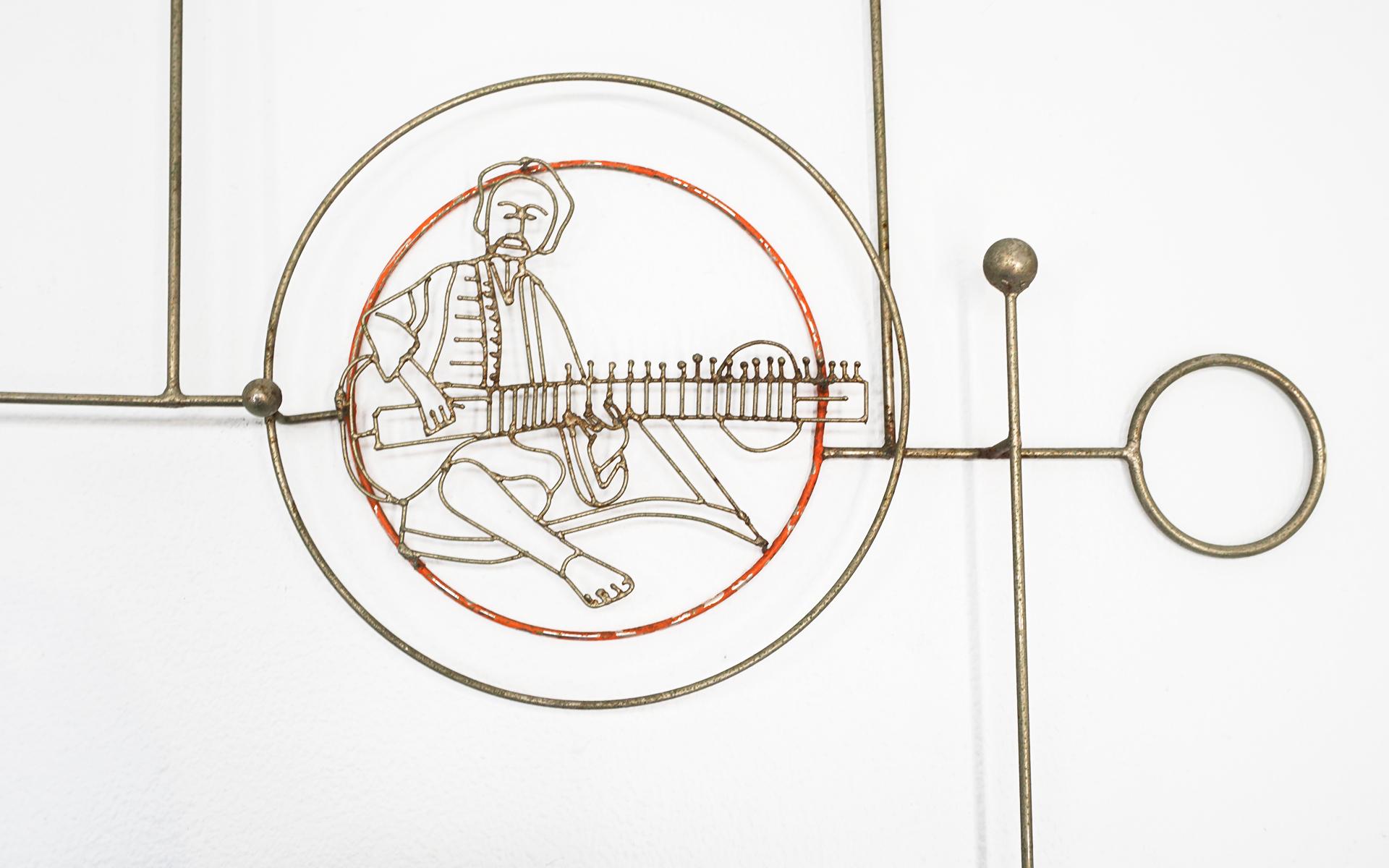 Rare 1970s Joseph Burlini metal wire abstract wall hanging sculpture with the image of sitar maestro Ravi Shankar. If you are a fan of the Shankar family of musicians, including daughter Nora Jones then this is a must have!