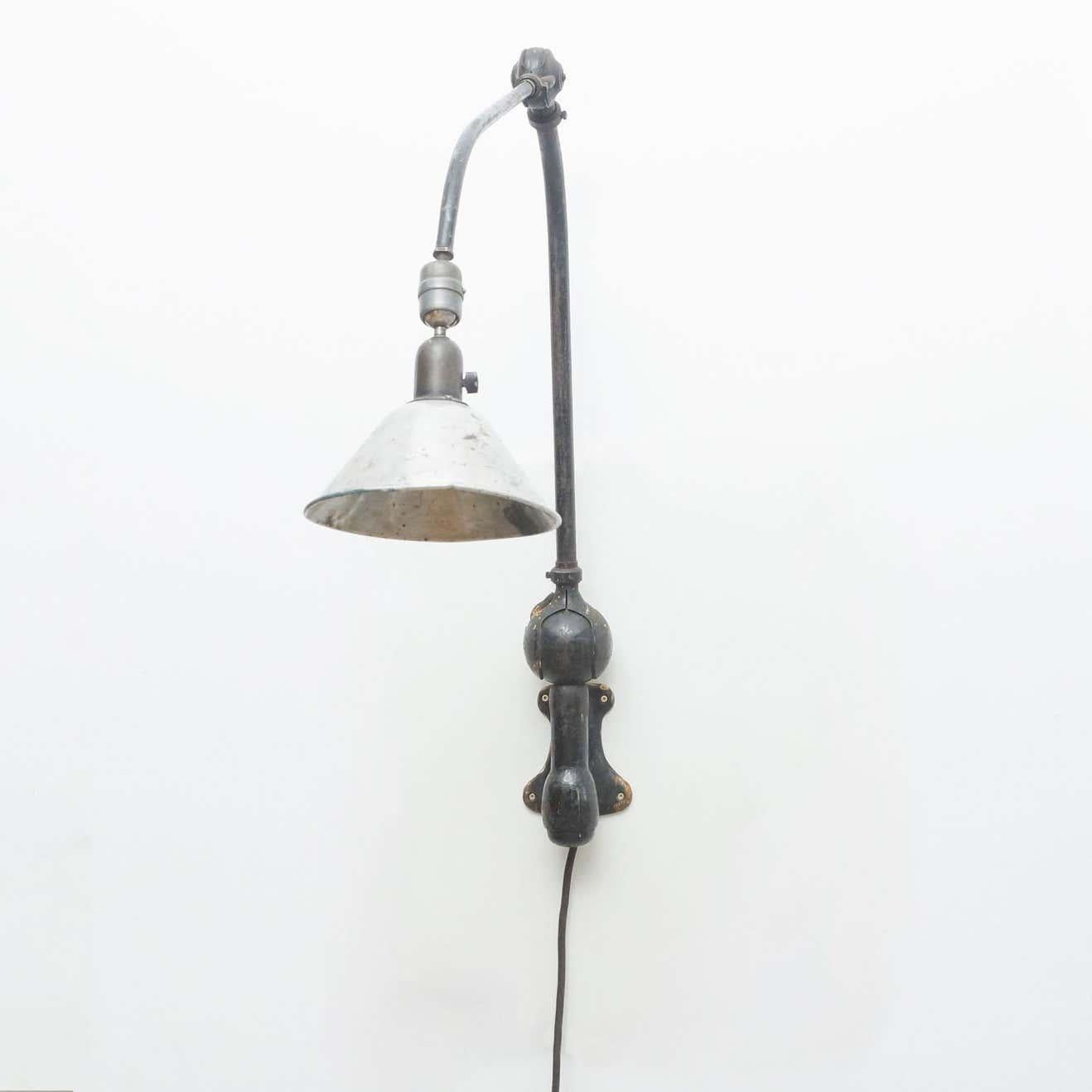 Wall lamp designed by Johan Petter Johansson.
Manufactured by Triplex (Sweden), circa 1930.
Aluminium and steel.

In good original condition with minor wear consistent with age and use, preserving a beautiful patina.

This lamp is wired for