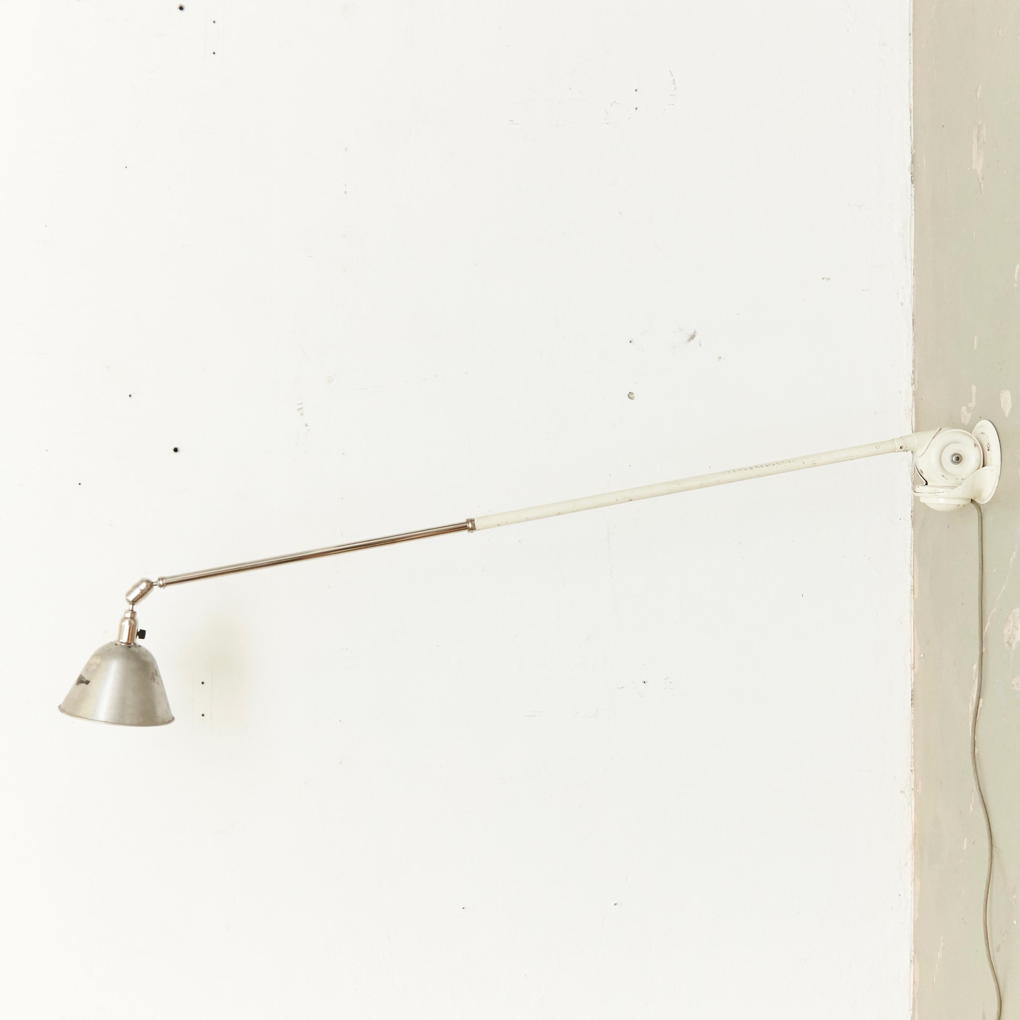 Telescopic wall lamp designed by Johan Petter Johansson.
Manufactured by Triplex, (Sweden), circa 1930.
Aluminium and steel.

In good original condition, with minor wear consistent with age and use, preserving a beautiful patina.