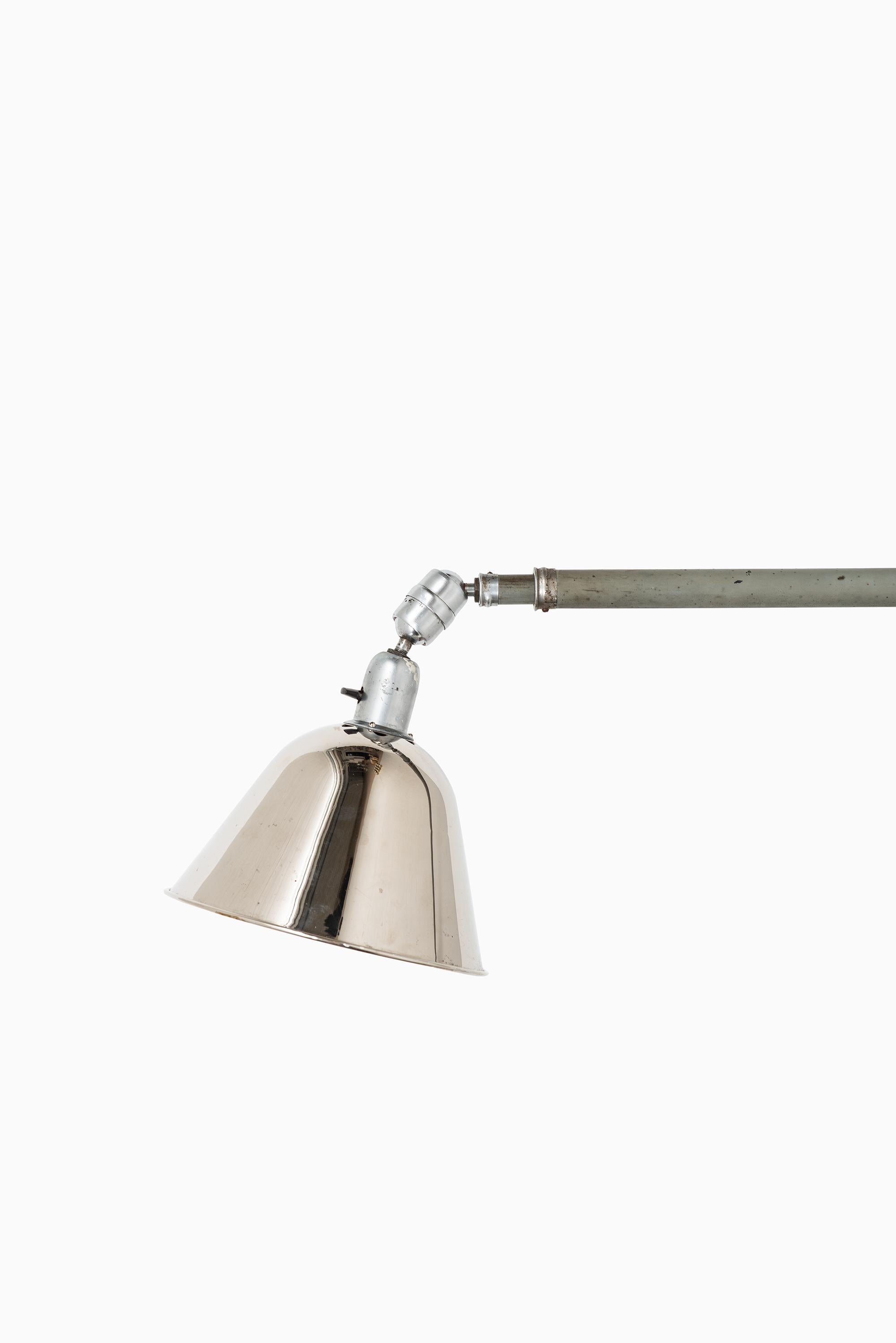 Extending triplex wall / ceiling lamp designed by Johan Petter Johansson. Produced by Triplex Fabriken in Sweden.