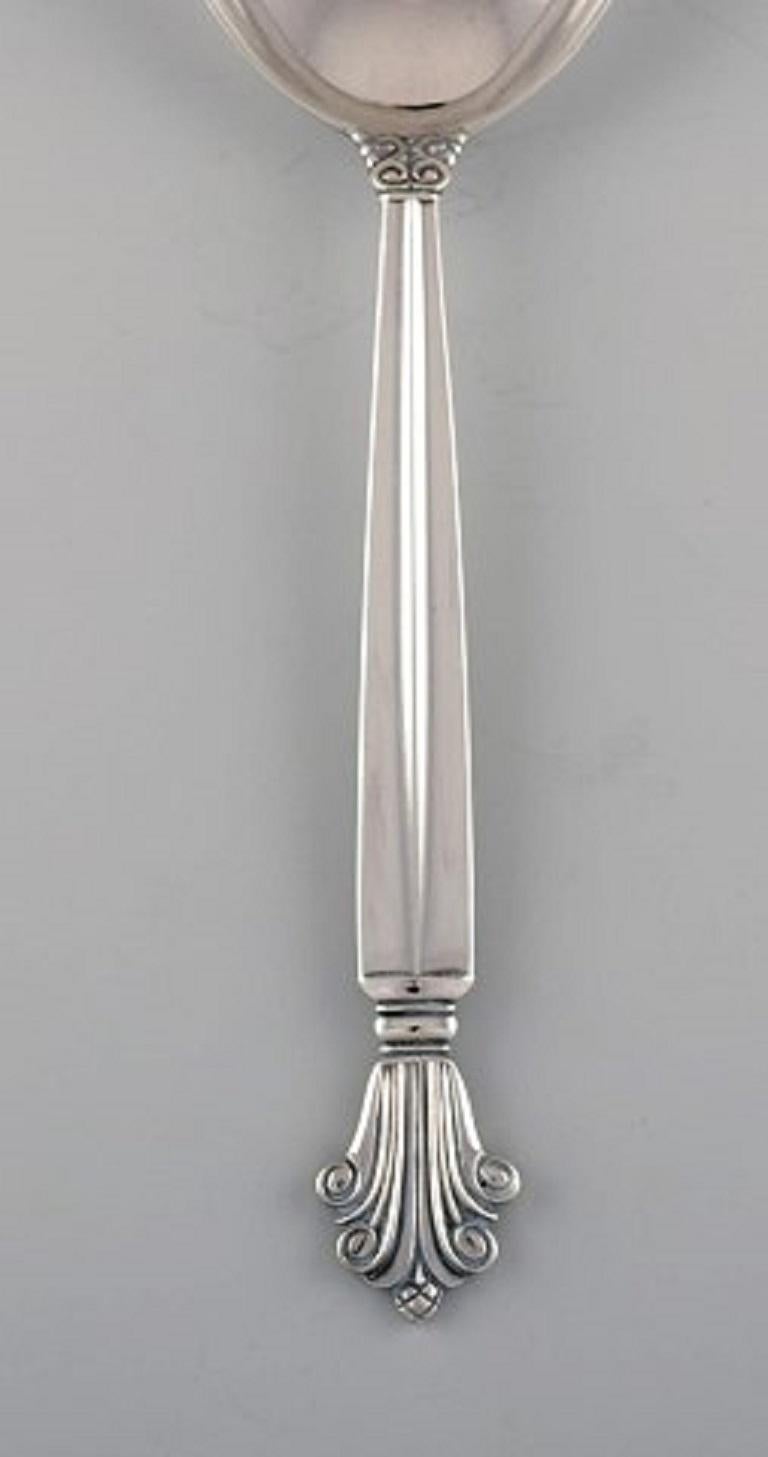 Johan Rohde for Georg Jensen. Acanthus serving spoon in sterling silver. Dated 1933-1944.
Measures: Length 20.5 cm.
Stamped.
In excellent condition.
Our skilled Georg Jensen silversmith / jeweler can polish all silver and gold so that it looks