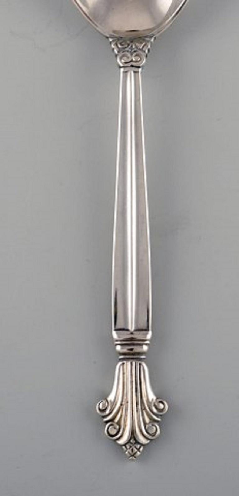 Johan Rohde for Georg Jensen. Early acanthus gourmet spoon in sterling silver. Dated 1922.
Size: Length 17 cm.
Stamped.
In excellent condition.
Our skilled Georg Jensen silversmith / jeweler can polish all silver and gold so that it looks like