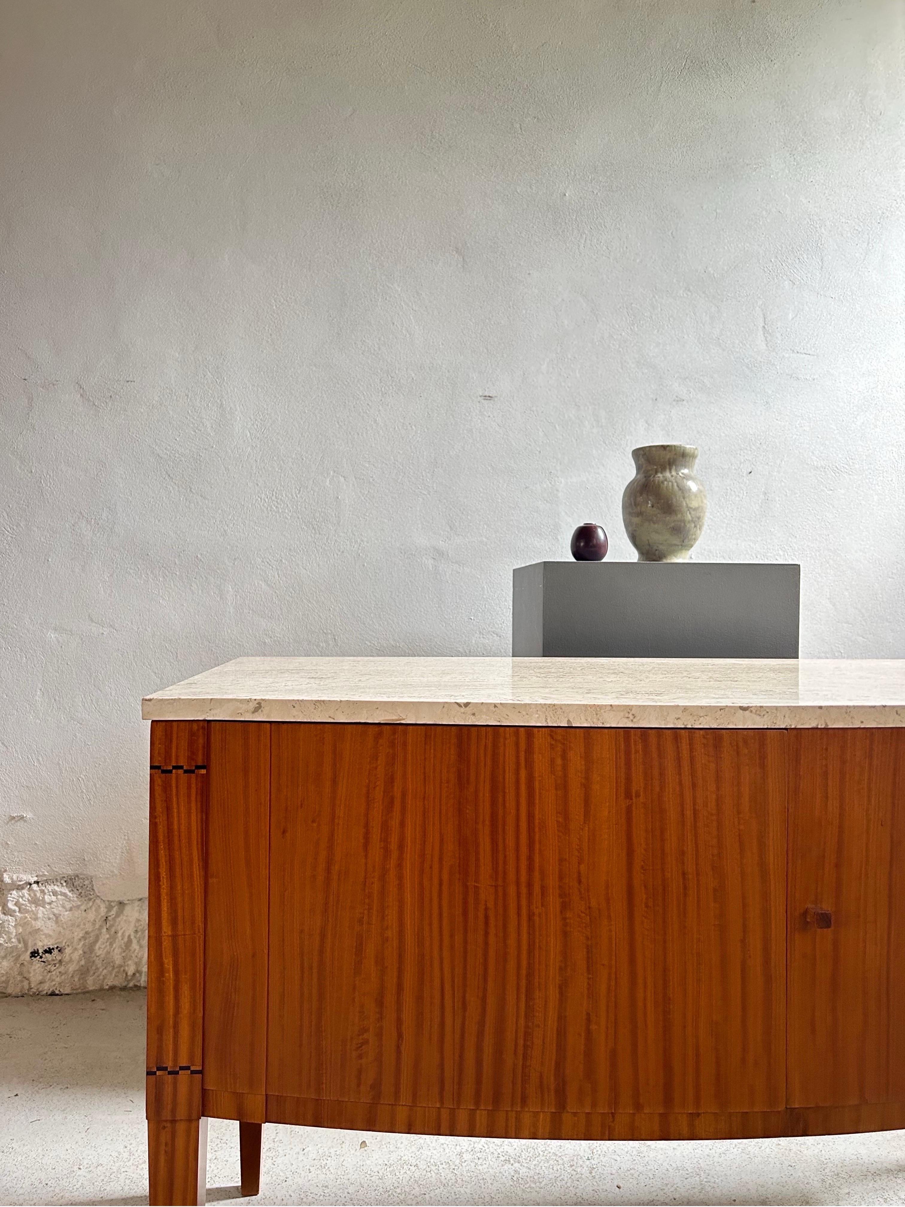 This unique sideboard, designed by prominent Danish architect and designer Johan Rohde around 1910, is a stunning example of early 20th-century Danish craftsmanship. Made by the highly skilled cabinetmaker H.P. Larsen, the piece combines premium