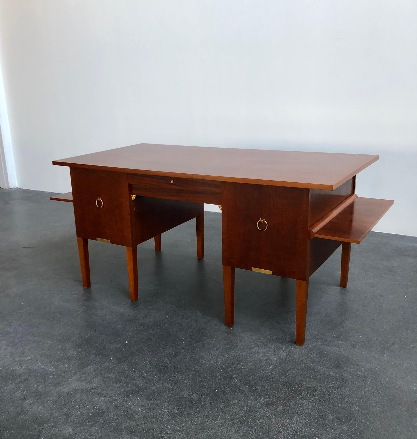Johan Rohde desk in mahogany with brass fittings. Right side have three drawers and left has three shelfs when doors open.

Provenance: This desk was made for H. P. Rohde in 1945, who was the son of Johan Rohde. Comes with the original water colour