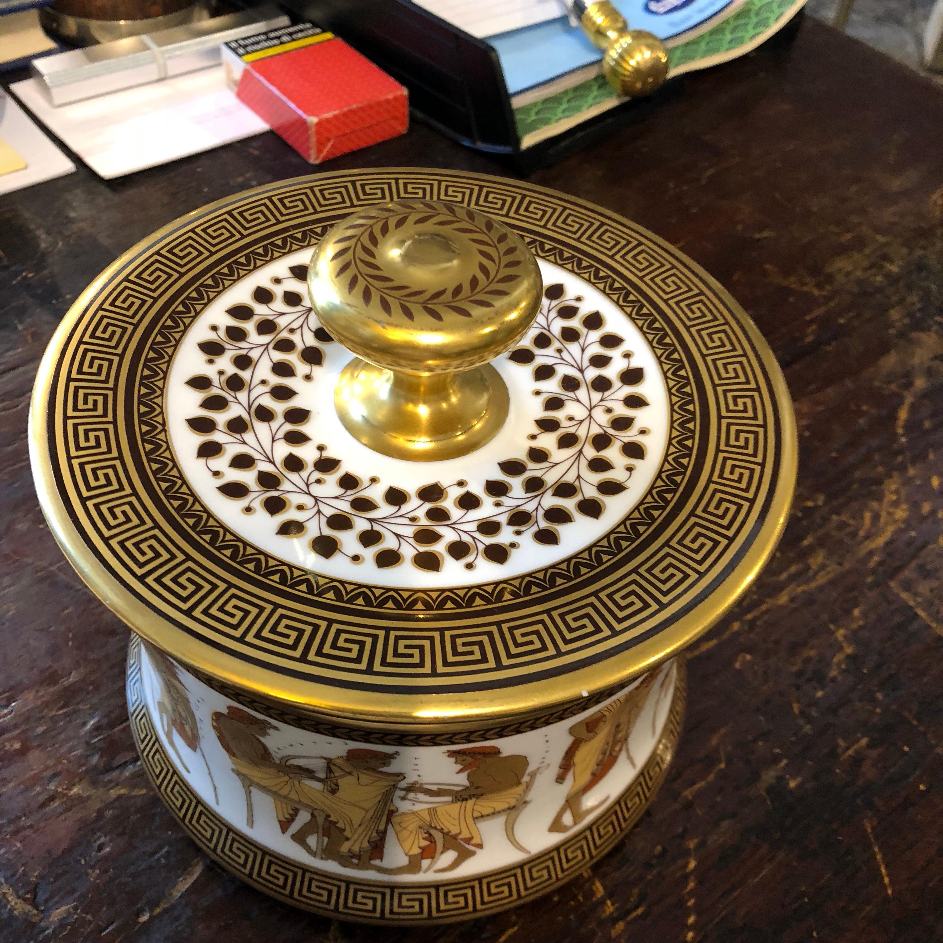 An amazing hand-painted biscuit box, pure gold finishes, very good conditions overall.