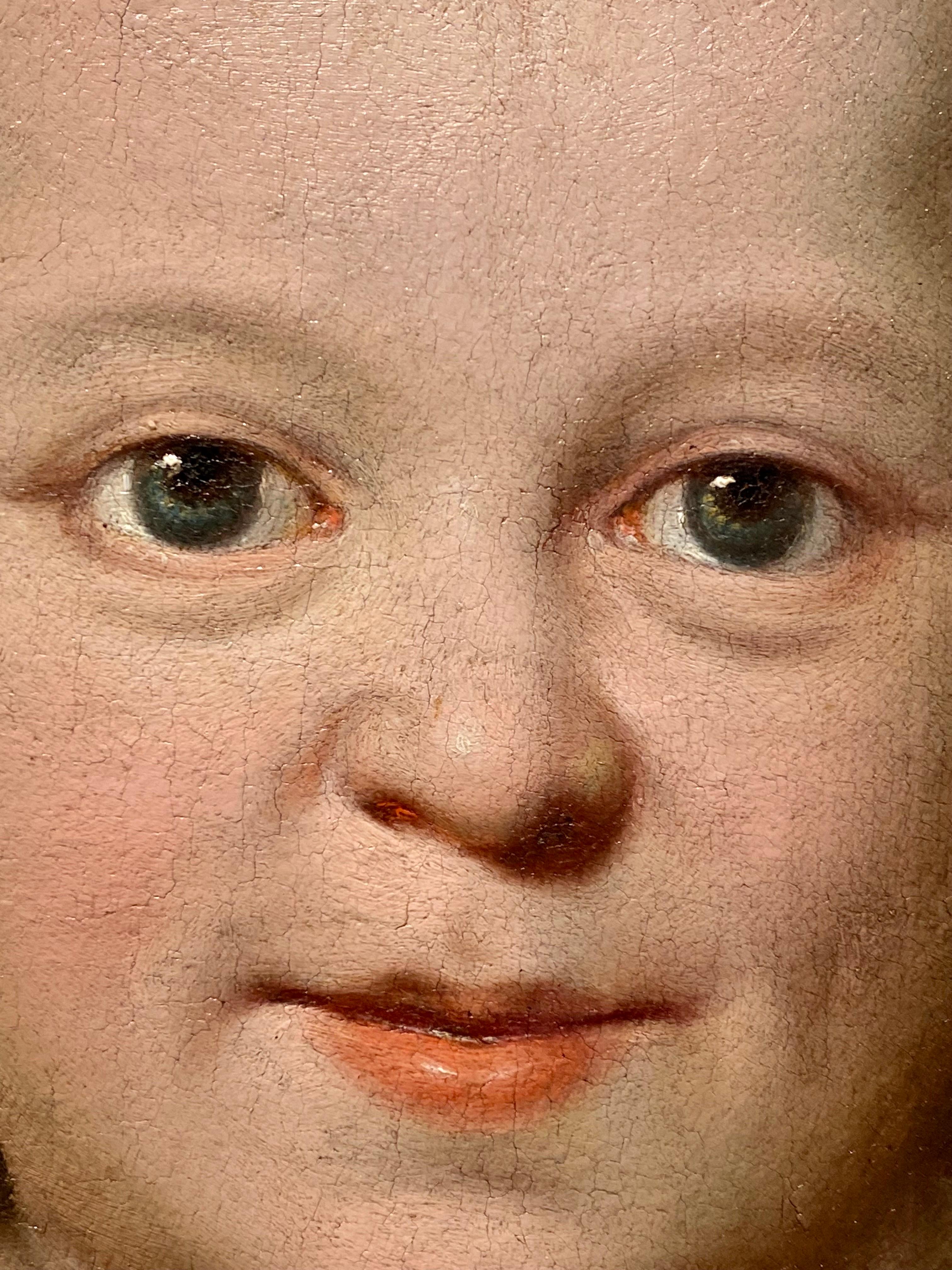 little girl holding demon dog painting