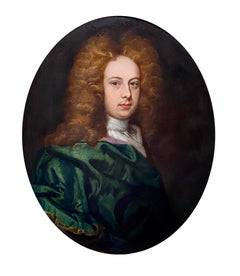 17TH CENTURY ENGLISH OIL PORTRAIT OF A YOUNG GENTLEMAN IN A GREEN SILK CLOAK.