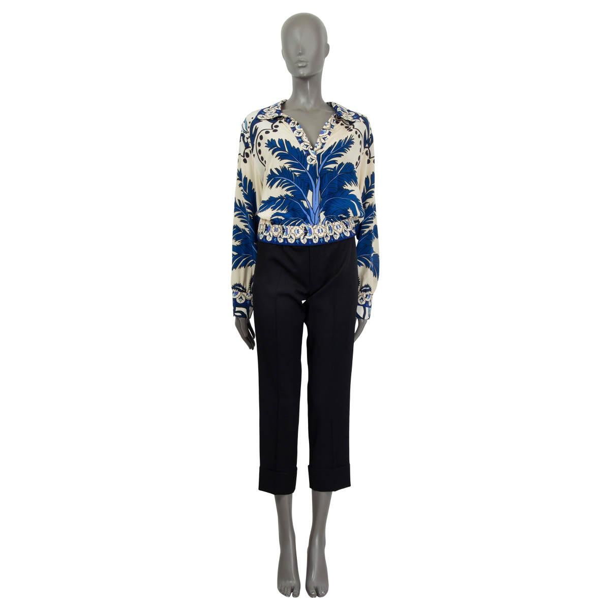 100% authentic Johanna Ortiz  'Al Son De La Palmera' cropped blouse in ivory, blue, purple and navy silk crepe de chine (100%). Features long sleeves, buttoned cuffs and an elastic waistband. Unlined. Has been worn and is in excellent
