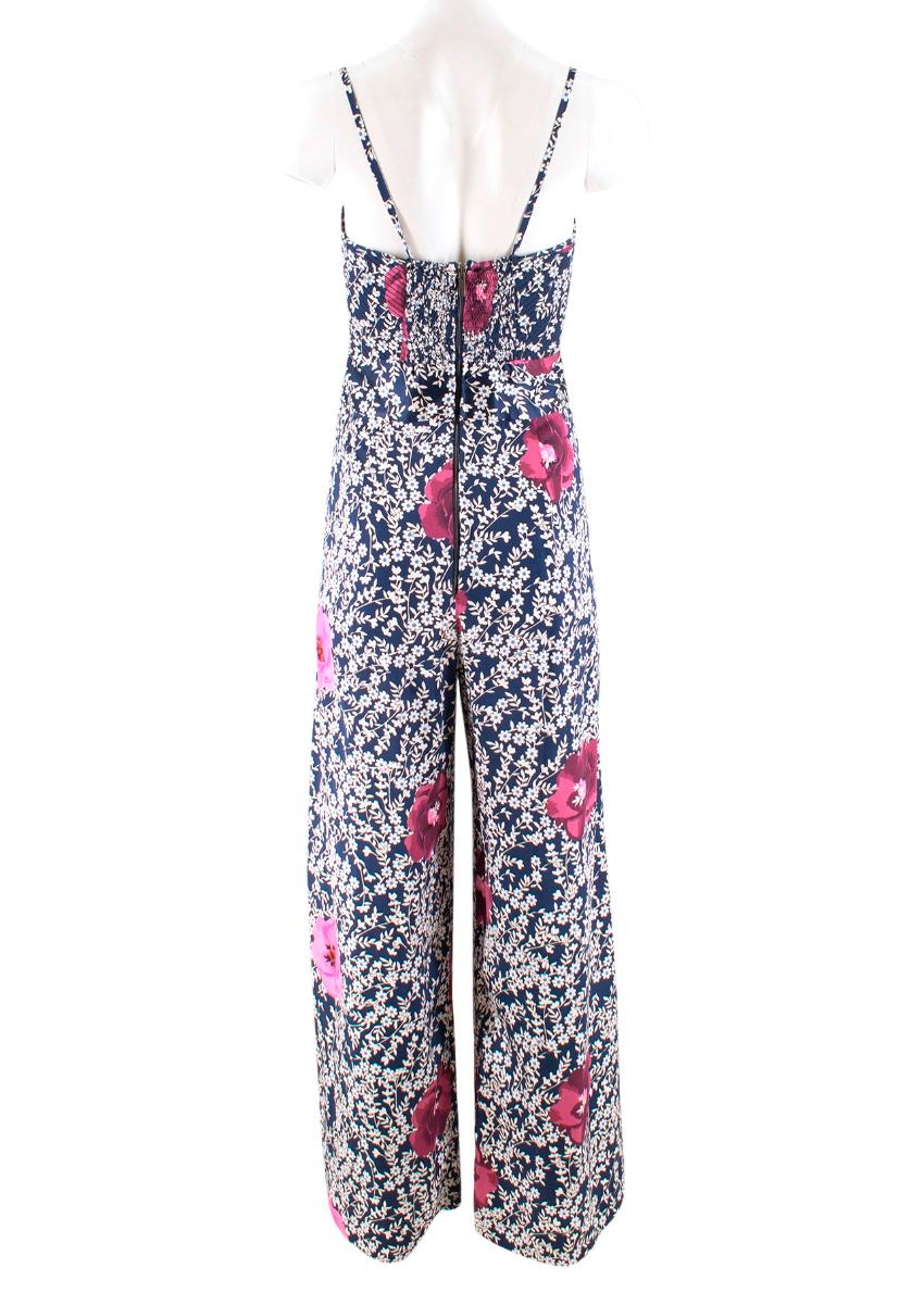 Johanna Ortiz Silk Printed Fermina Jumpsuit.

- Silk charmeuse
- Sweetheart neckline with bow accent and cutout
- Camisole straps
- Back zip
- Composition: 100% silk

US 4 / UK 8
Approx: 

Length: 130cm
Bust: 34cm
Leg inseam: 75cm