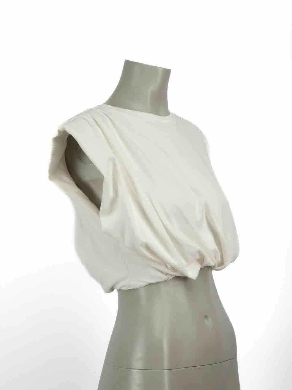 CONDITION is Very good. Minimal wear to top is evident. Minimal wear to fabric with tiny spot at front right near side seam on this used Johanna Ortiz designer resale item.

Details
White
Cotton
Sleeveless crop top
Ruched accent
Padded
