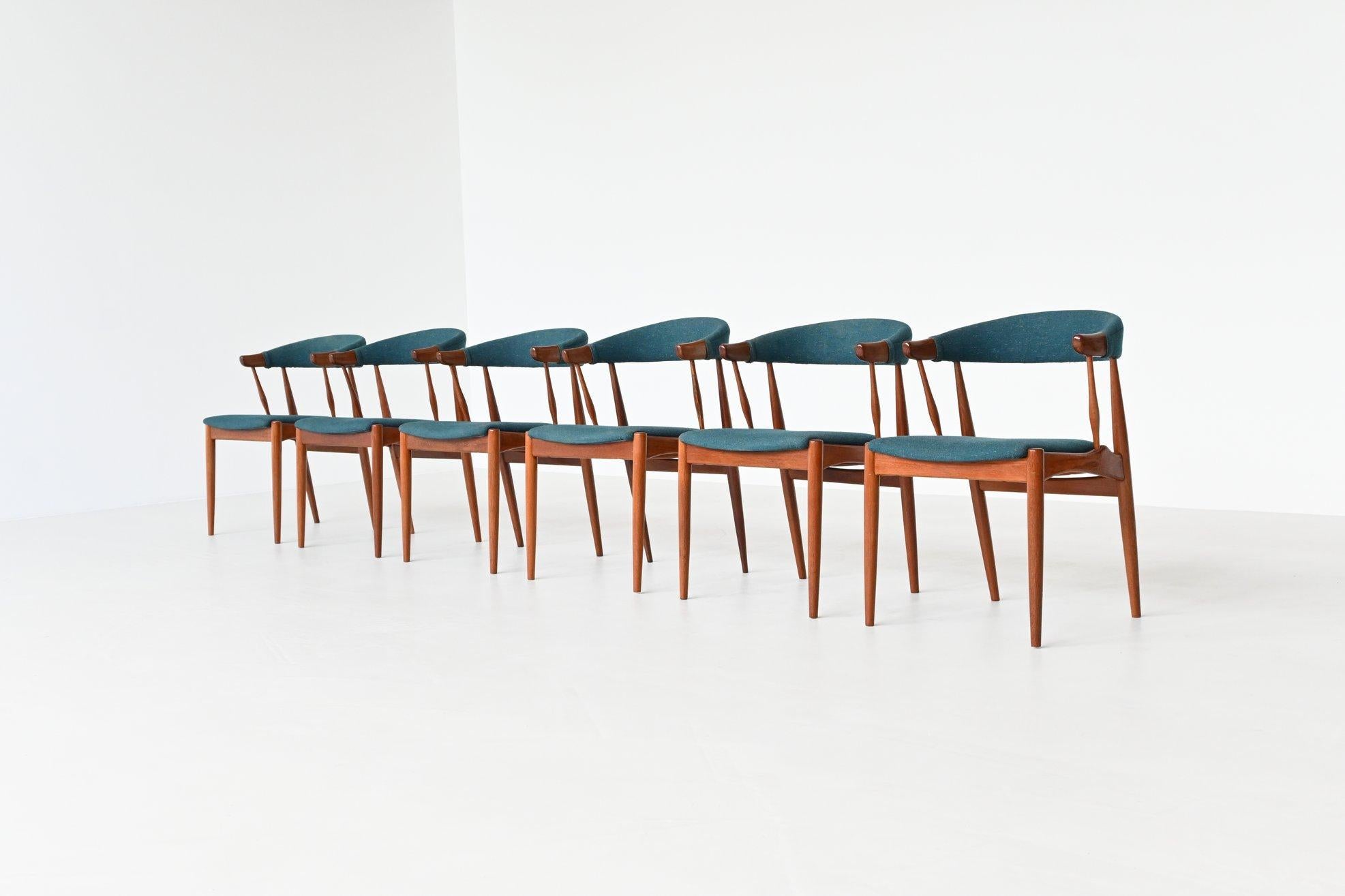 Stunning set of six dining chairs model BA113 designed by Johannes Andersen and manufactured by Brdr. Andersens Møbelfabrik A/S, Denmark 1969. The chairs feature a striking sculptural design and solid teak construction. They are upholstered with
