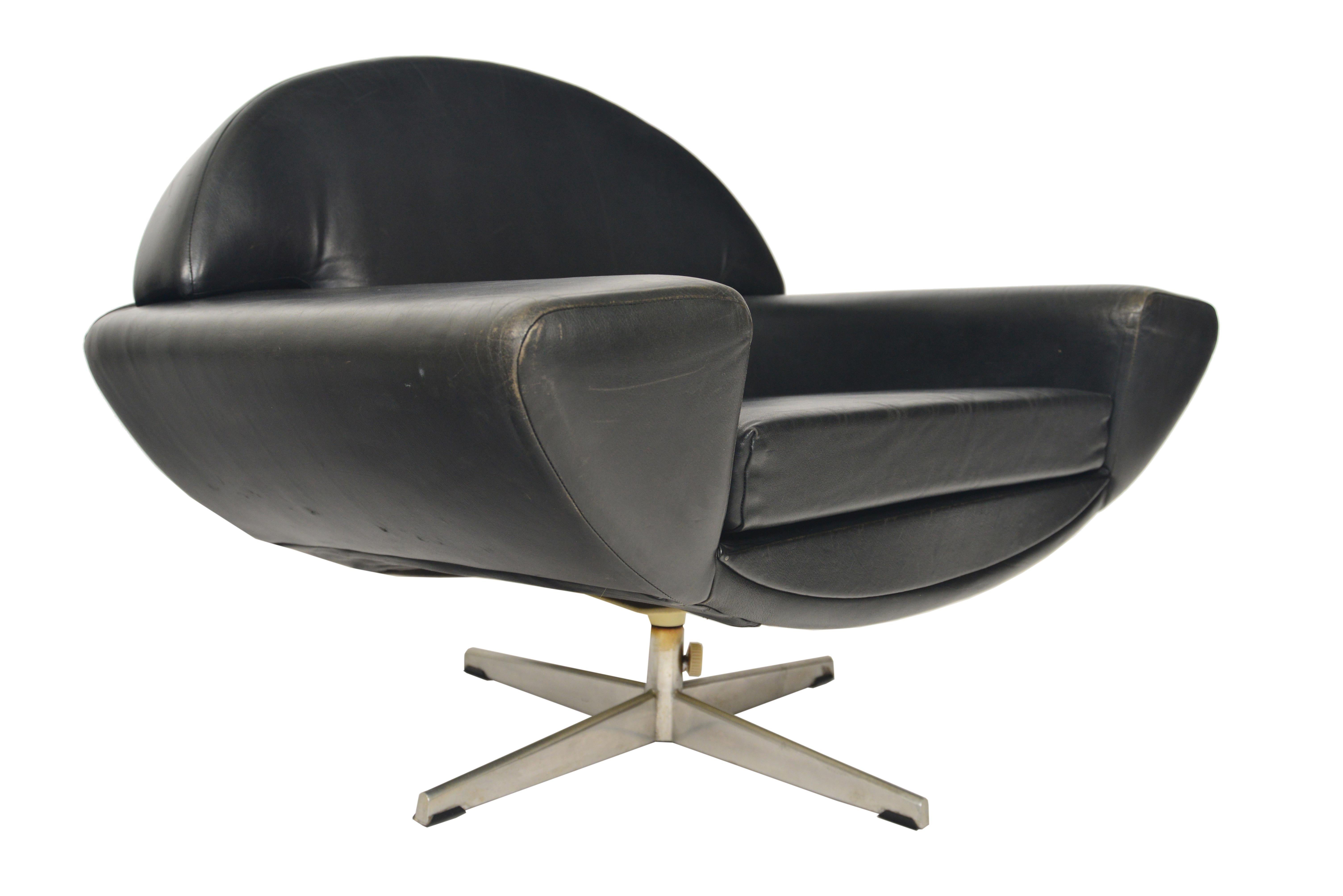 Designed with an eye on the future, this lounge chair by Johannes Andersen for Trensom of Sweden was produced in 1958 as the 'Capri' line. A sweeping arch extends to wide arms and houses a loose cushion. The chair stands on a chromed four star base.