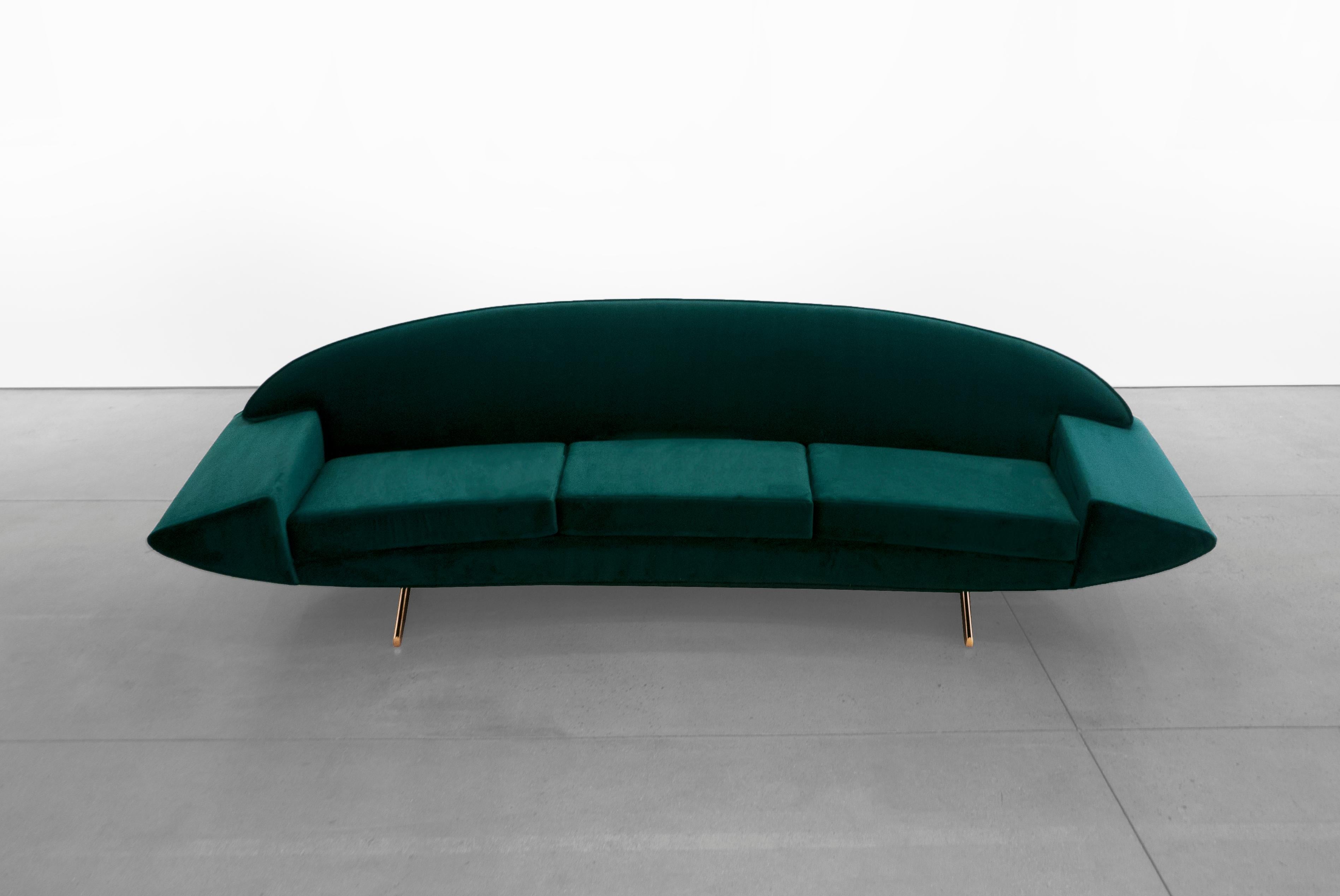 Boomerang shaped meticulously upholstered 'Capri' sofa with Dedar Milano velvet on a gold-plated T-legged frame, designed by Johannes Andersen in the 1950's. 

Johannes Andersen (Danish, 1903–1995) apprenticed as a cabinet maker, becoming certified