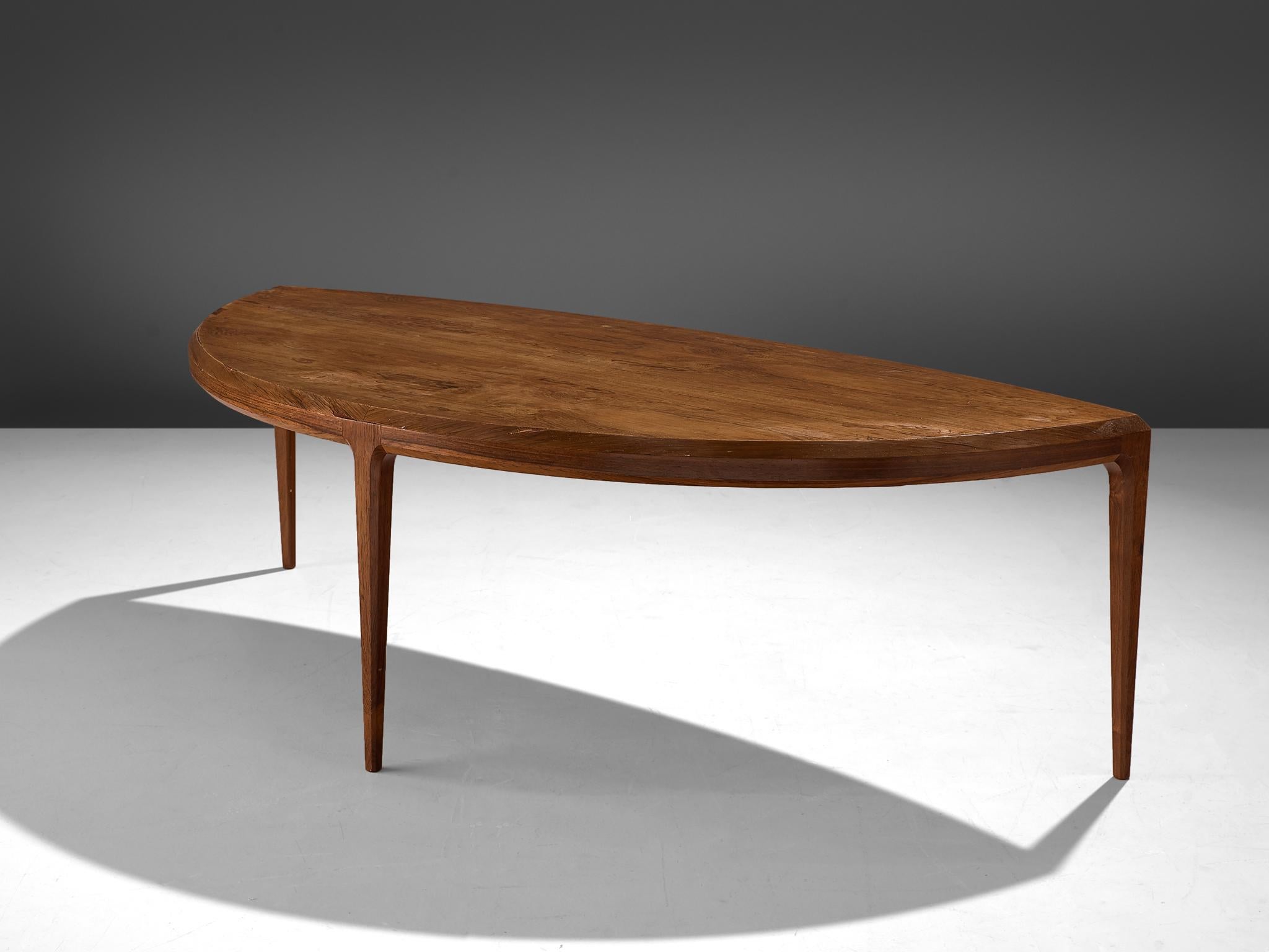 Johannes Andersen for Silkenborg, coffee table, rosewood, Denmark, 1950s.

Organic shaped coffee table in rosewood. This three legged coffee table shows the great craftsmanship of Johannes Andersen as furniture designer. The design is simplified,