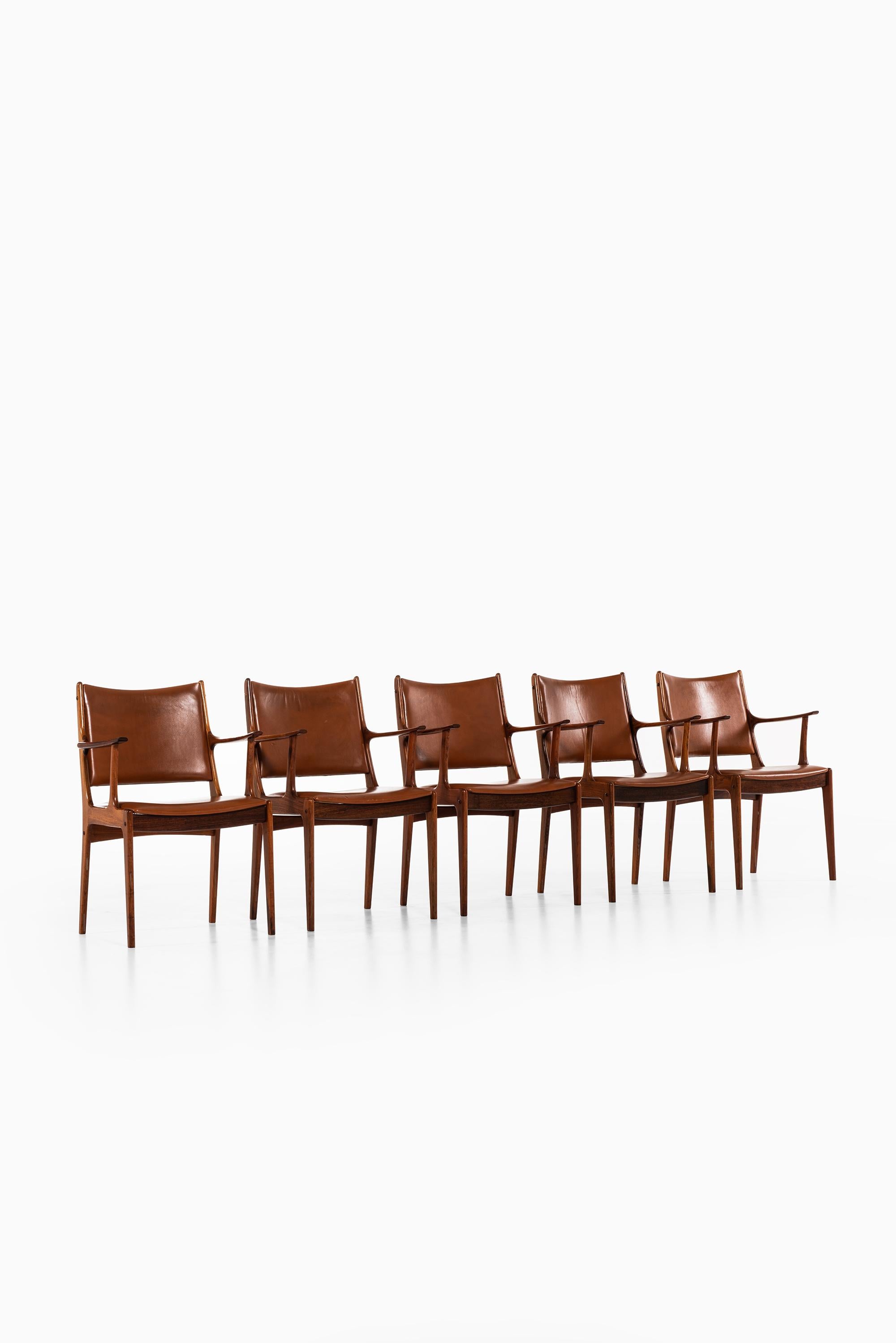 Set of 10 dining chairs / armchairs designed by Johannes Andersen. Produced by Uldum Møbelfabrik in Denmark.