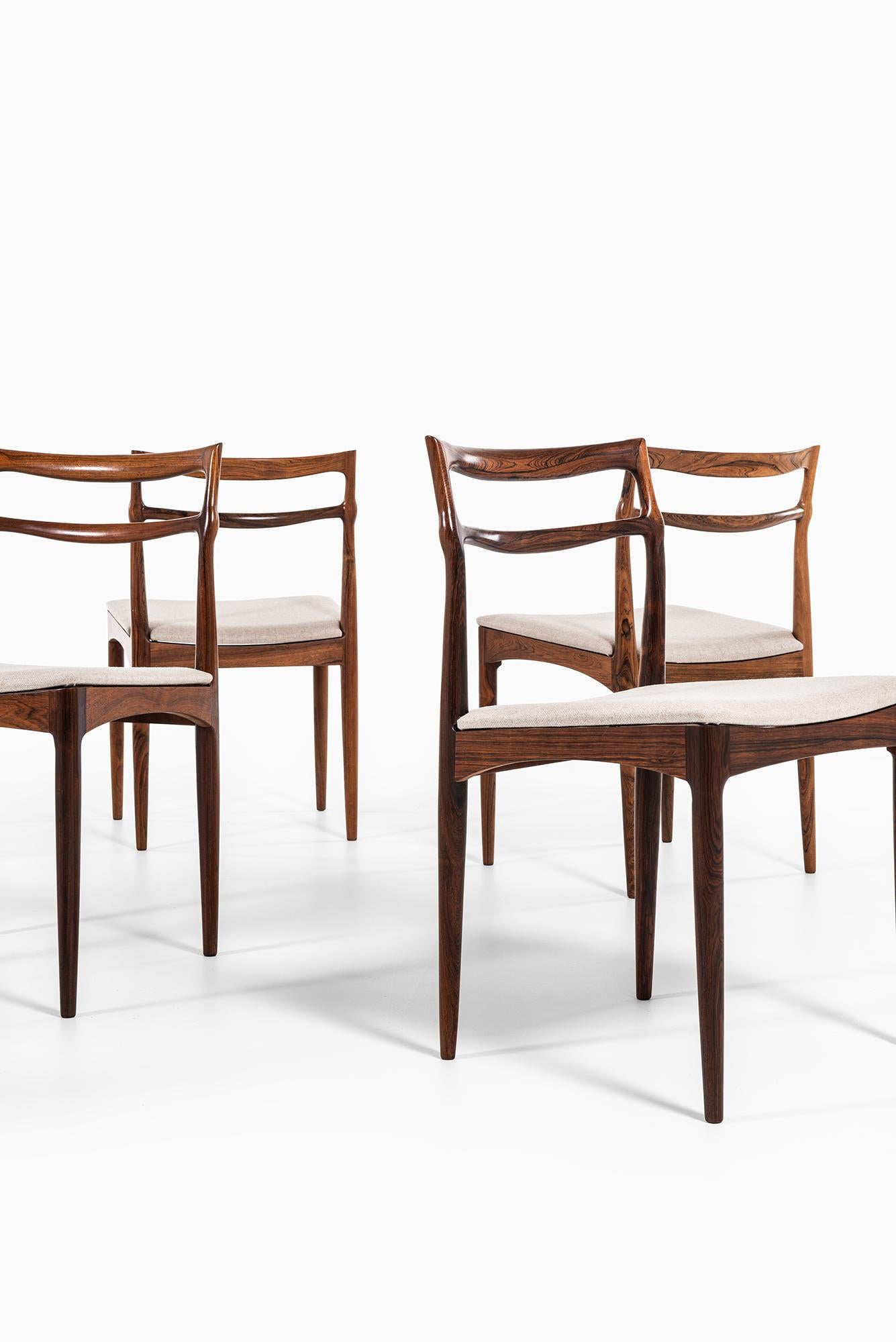 Rare set of eight dining chairs designed by Johannes Andersen. Produced by Chr. Linnebergs Møbelfabrik in Denmark.