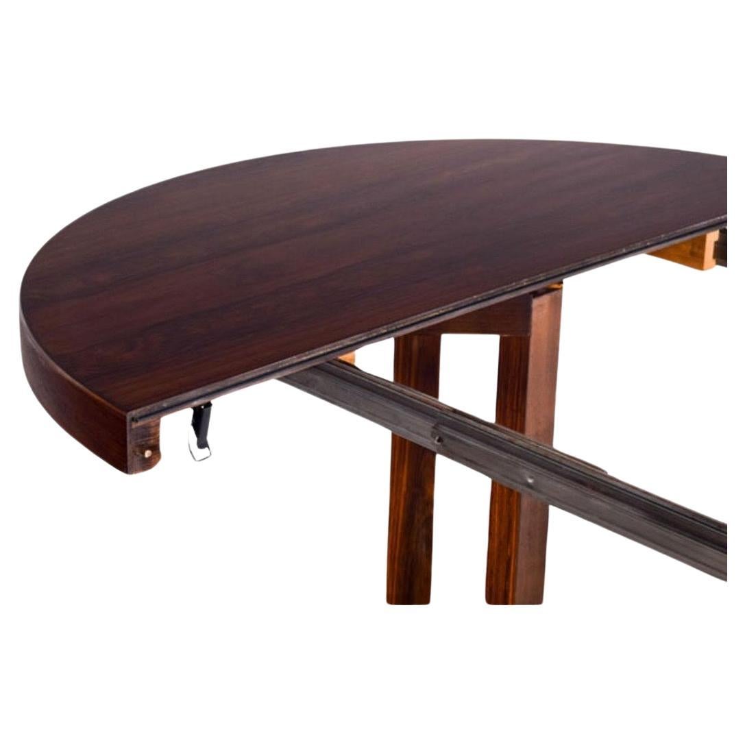 Rare dining table designed by Johannes Andersen. Produced by Hans Bech in Denmark.Xlarge when extended 23.5
