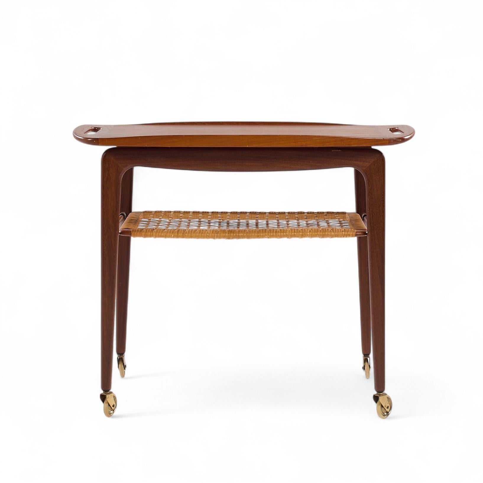 Johannes Andersen for CFC Silkeborg Mid Century Danish Teak Bar Serving Cart

This bar cart measures: 28 wide x 17.5 deep x 22.5 inches high

We take our photos in a controlled lighting studio to show as much detail as possible. We do not Photoshop