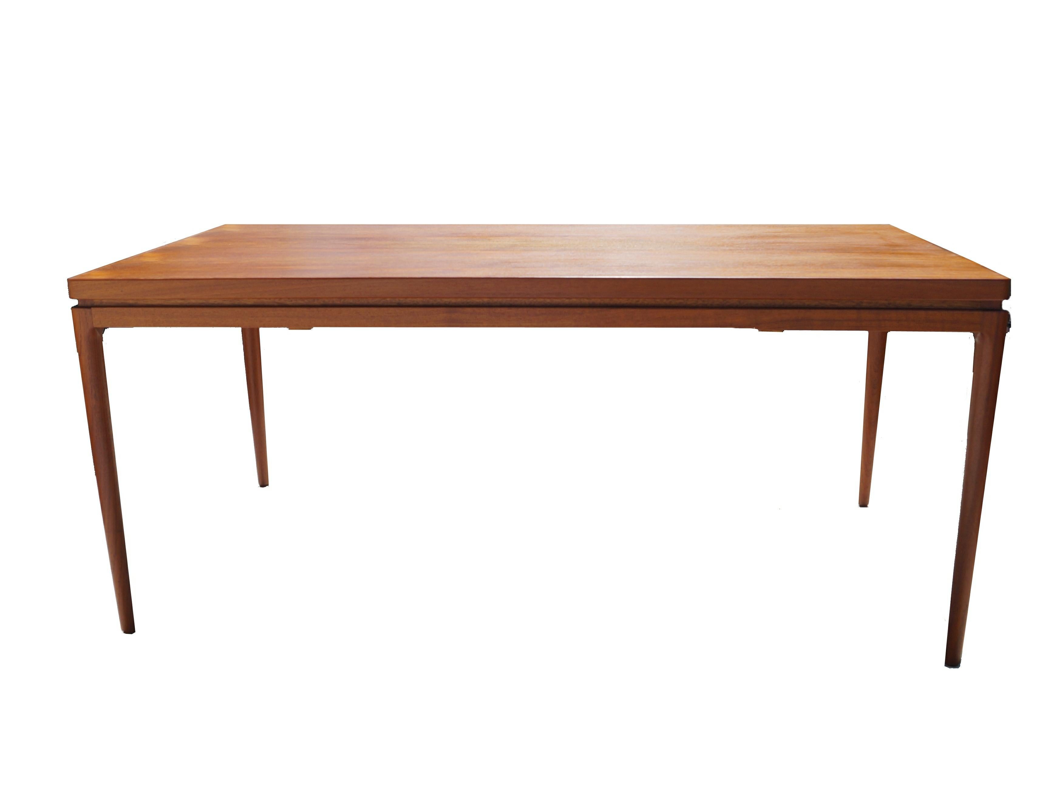 Johannes Andersen for Christian Linneberg teak dining table. Teak extending dining table with pair of store away extension leaves . You can store the extension leaves underneath the tabletop. It measures 104.50