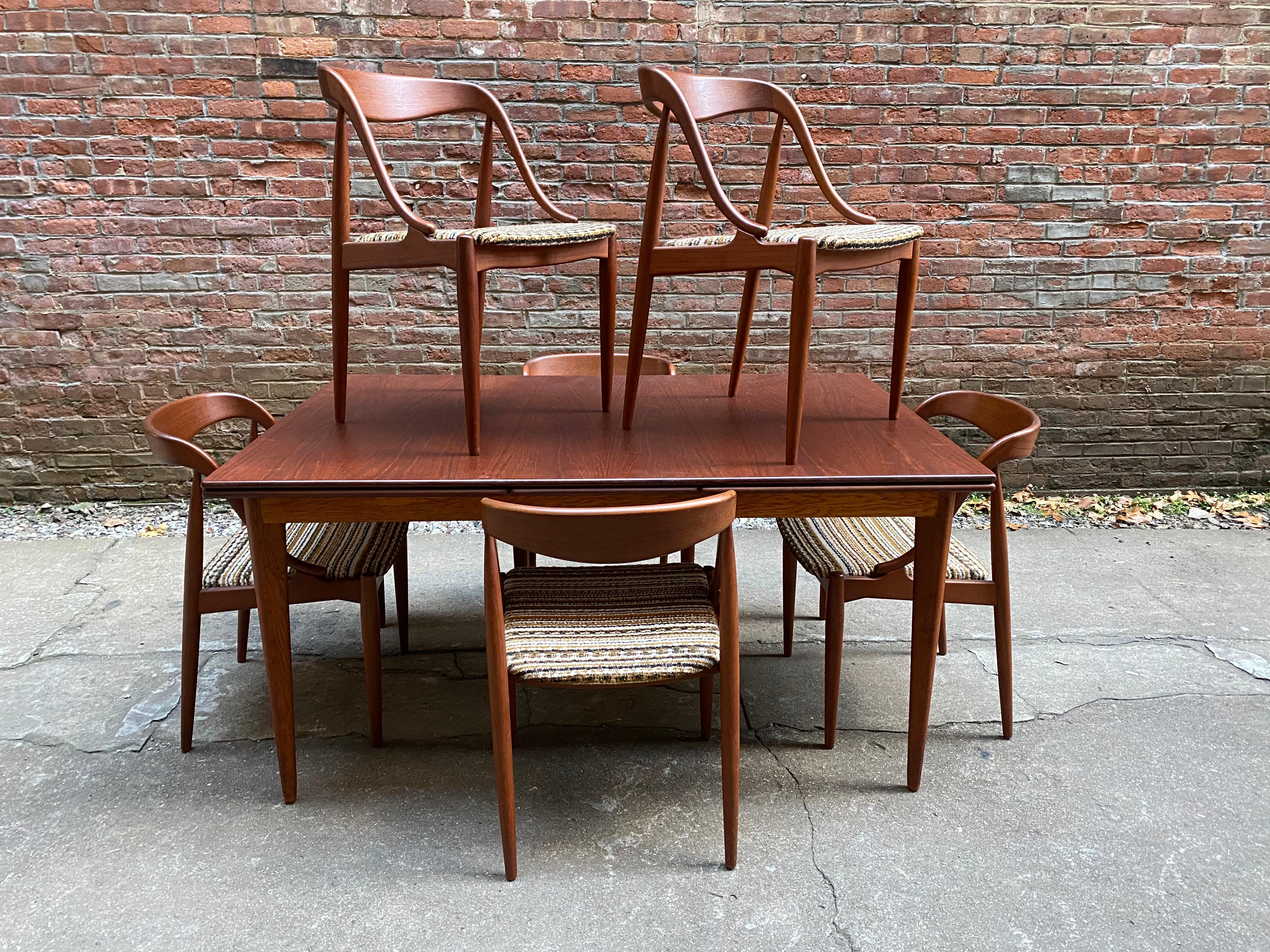 Set of six sculptural teak dining chairs by Johannes Andersen for Moreddi, Denmark. Beautiful solid teak frames with wonderful nubby wool fabric upholstered seats. A comfortable chair. Signed on seat bottoms. All are structurally sound and sturdy.