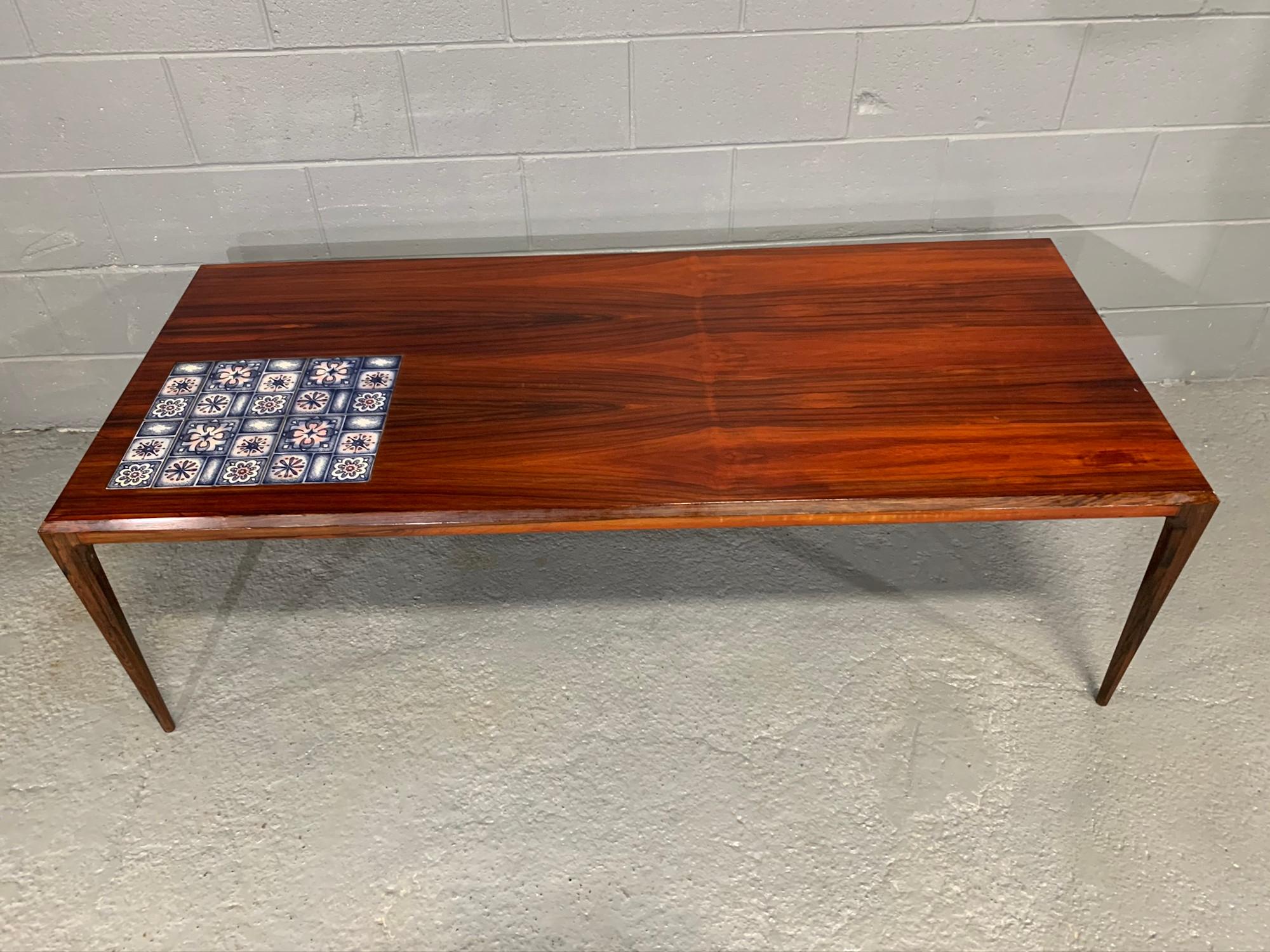 Mid-Century Modern 1960s rosewood coffee table with Royal Copenhagen tiles designed by Johannes Andersen and manufactured by Silkeborg Furniture.