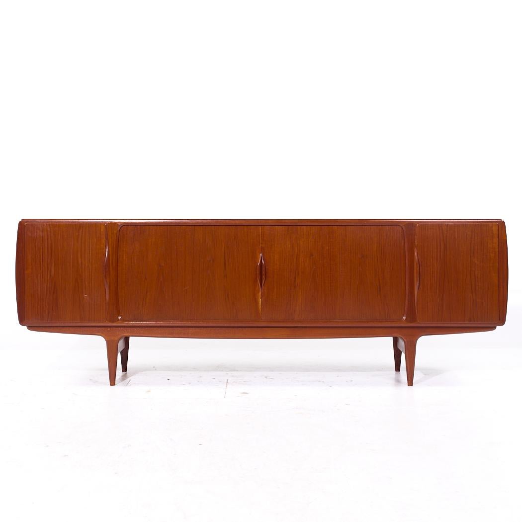 Johannes Andersen for Uldum Mid Century Danish Teak Tambour Door Credenza

This credenza measures: 96.5 wide x 20 deep x 33 inches high

All pieces of furniture can be had in what we call restored vintage condition. That means the piece is restored