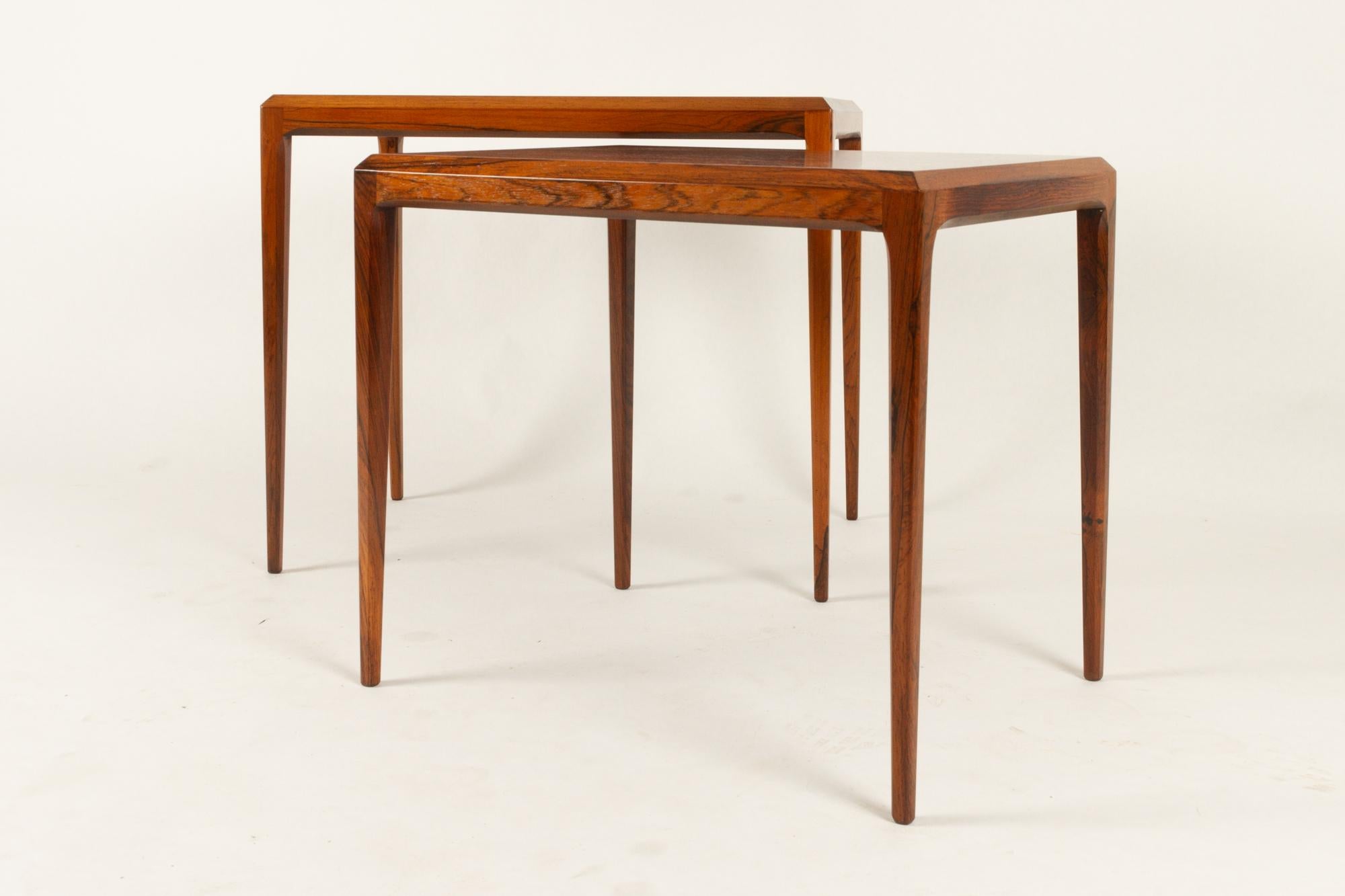 Johannes Andersen nesting tables by CFC Silkeborg Denmark, 1960s.
Set of two Danish Mid-Century Modern rosewood nesting tables. Tapered edges and legs in the Classic style of Johannes Andersen. 
Very good condition. Cleaned and polished. Ready for