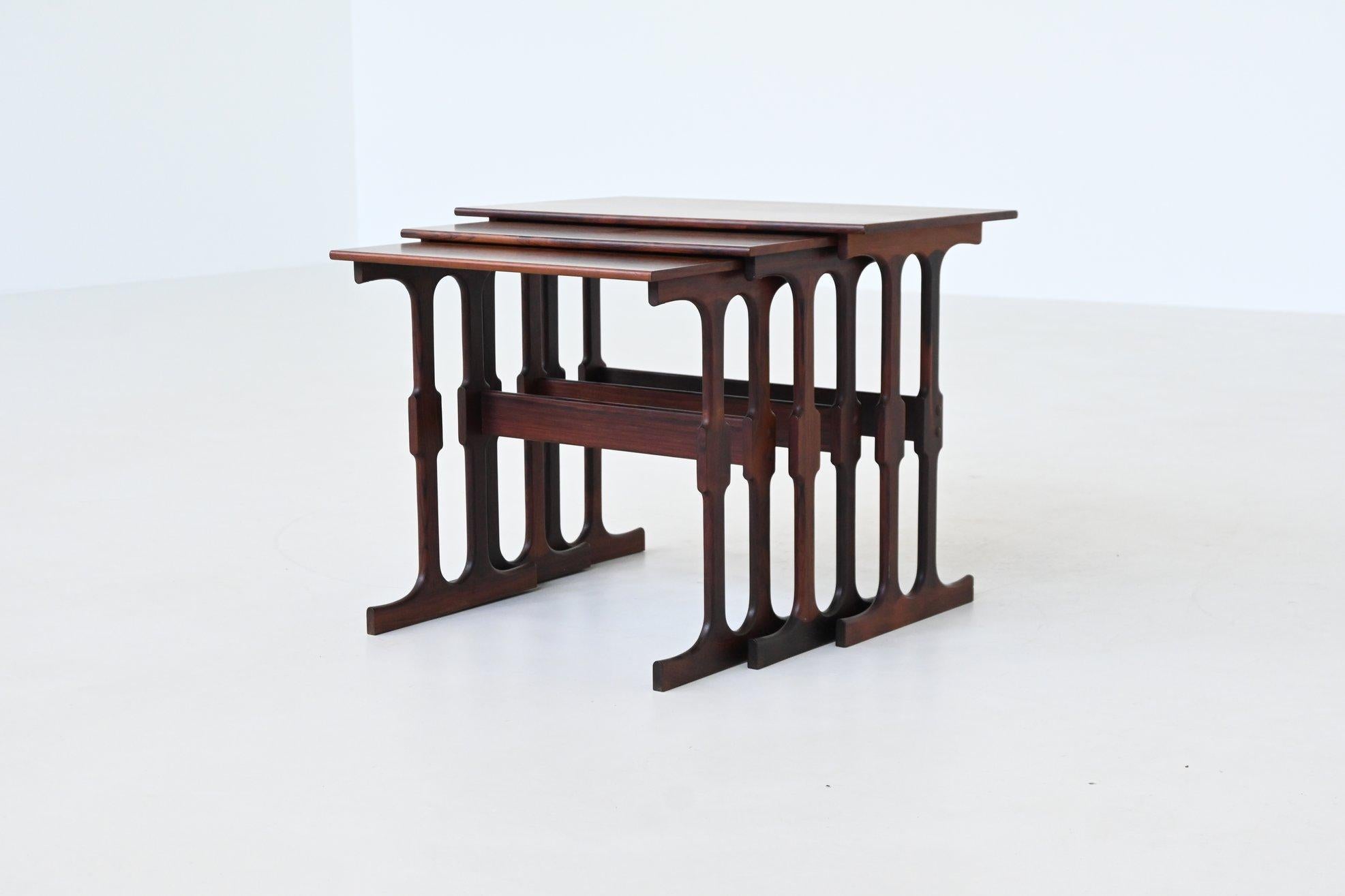 Exquisite set of three nesting tables designed by Johannes Andersen for Silkeborg in the 1960s, Denmark. This is a rare and highly collectible example of Danish modern design. Each table showcases Andersen’s signature sculptural sensibility, with