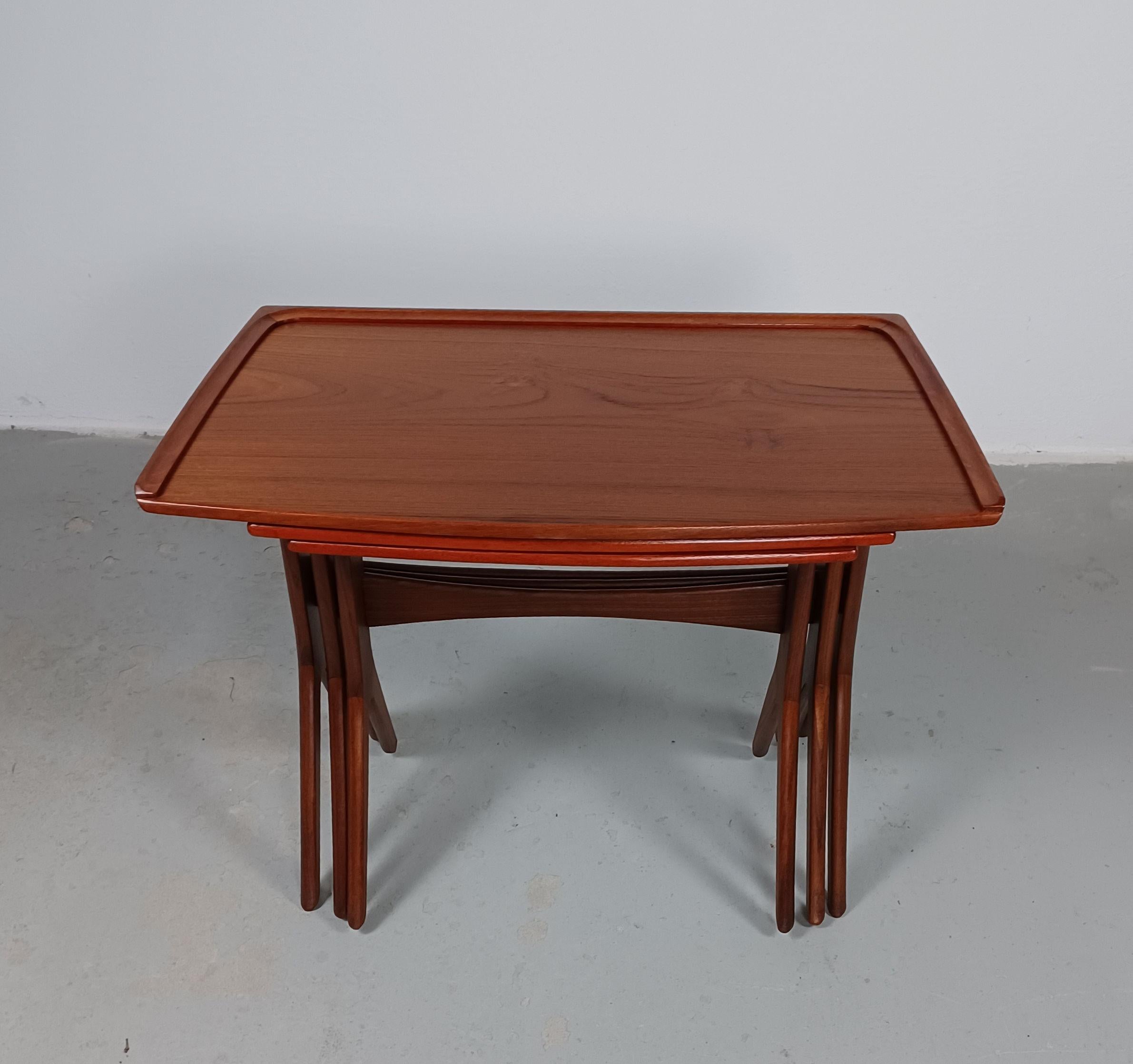 1960's Johannes Andersen restored set of Danish teak nesting tables by CFC Silkeborg.

The simple minimalistic yet well shaped, space conserving and practical easy to use nesting tables have been fully restored and refinished by our skilled and
