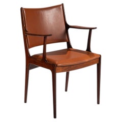 Poltrona in palissandro Johannes Andersen Uldum Mobelfabrik Danimarca 1960