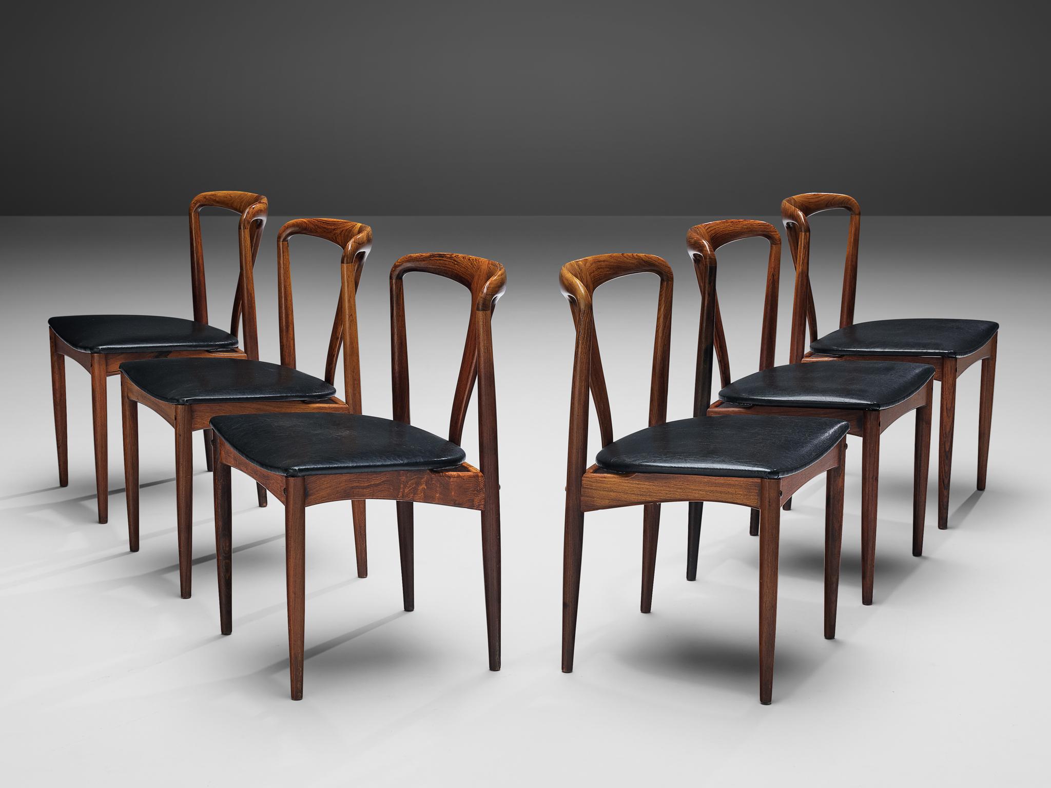 Johannes Andersen for Uldum Møbelfabrik, 'Juliane' set of six dining chairs, rosewood, faux leather, upholstery, Denmark, 1960s

This set of six dining chairs is designed by the Danish designer Johannes Andersen and produced by Uldum Møbelfrabrik in
