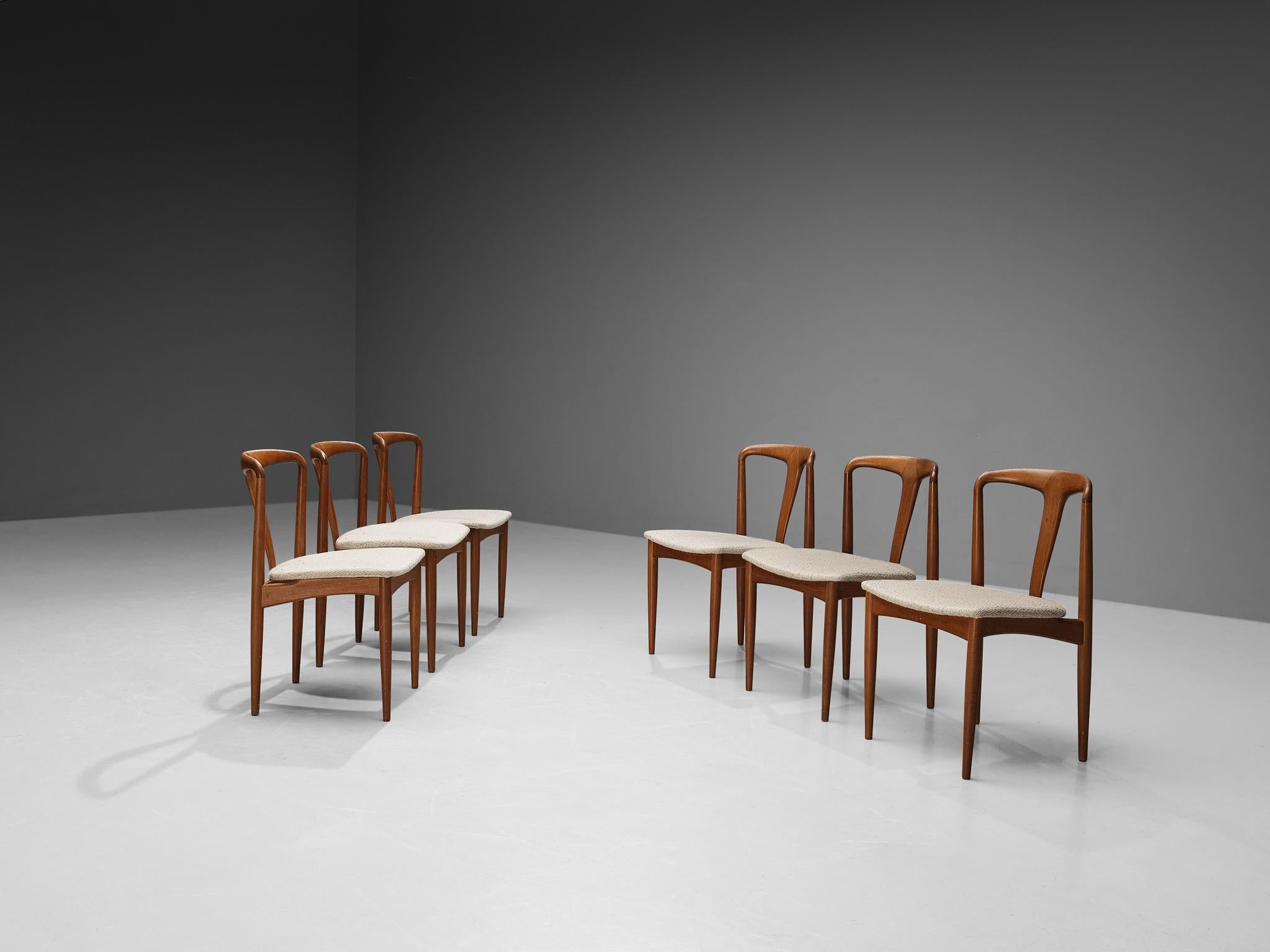 Johannes Andersen for Uldum Møbelfabrik, set of six dining chairs model ‘Juliane’, teak, fabric, Denmark, 1960s

This set of dining chairs is designed by Danish designer Johannes Andersen and produced by Uldum Møbelfabrik in Denmark. The chairs are
