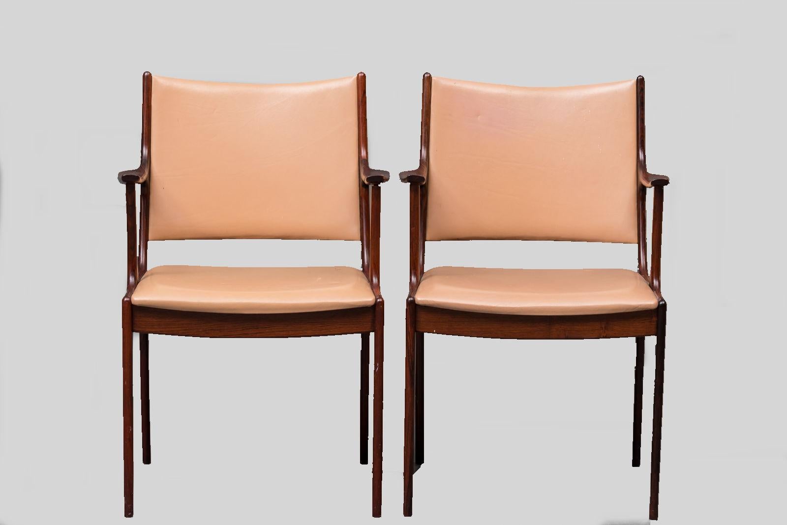 Set of two 1960s Johannes Andersen armchairs in rosewood made by Uldum Møbler, Denmark.

The armchairs feature a clean simple yet elegant design that will fit in well in most houses. 

The chairs have been restored and refinished by our