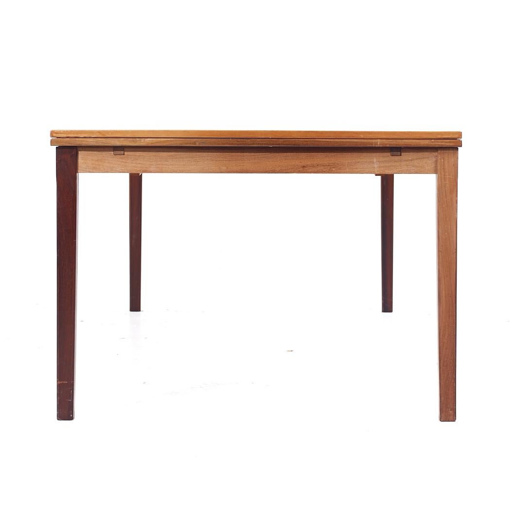 Late 20th Century Johannes Andersen Style Mid Century Danish Rosewood Hidden Leaf Dining Table For Sale