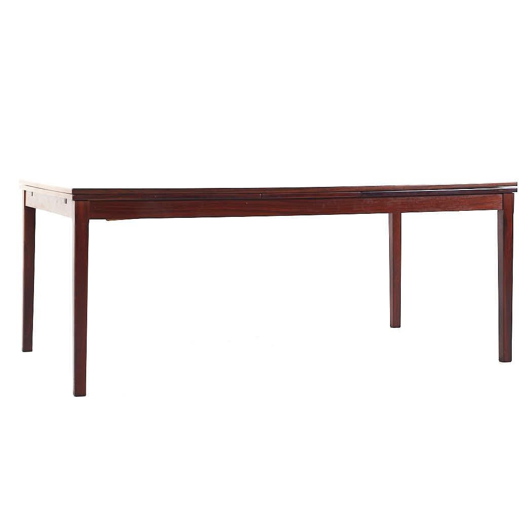 Johannes Andersen Style Mid Century Rosewood Hidden Leaf Dining Table

This table measures: 71 wide x 40 deep x 29 inches high, with a chair clearance of 28.5 inches, when the hidden leaf is engaged the table width is 126 inches

All pieces of
