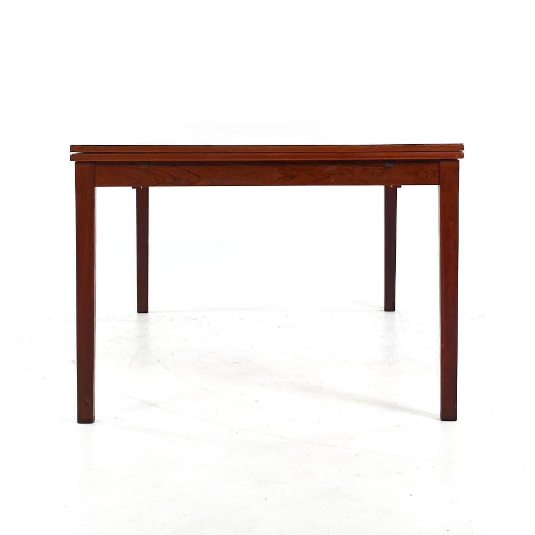 Late 20th Century Johannes Andersen Style Mid Century Rosewood Hidden Leaf Dining Table For Sale