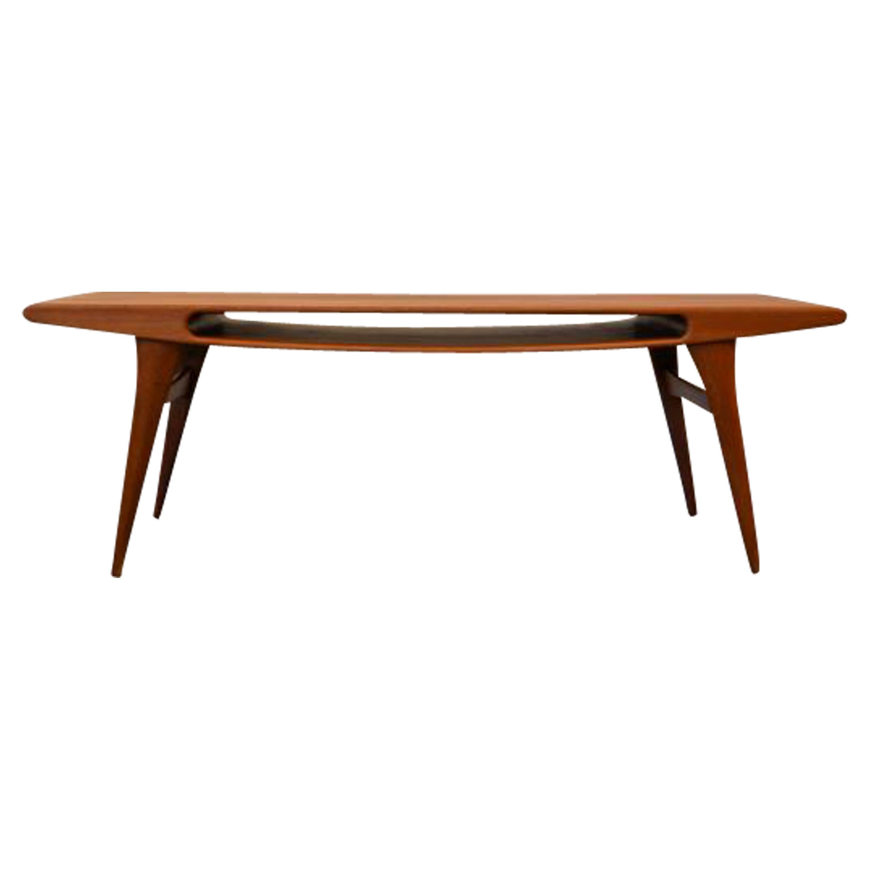 Absolutely stunning vintage Danish design “Smile” coffee table. This unique design adds an instant “wow” and smile to your modern or vintage interior. The smile shaped opening is not just fancy design, it’s also storage space for magazines and