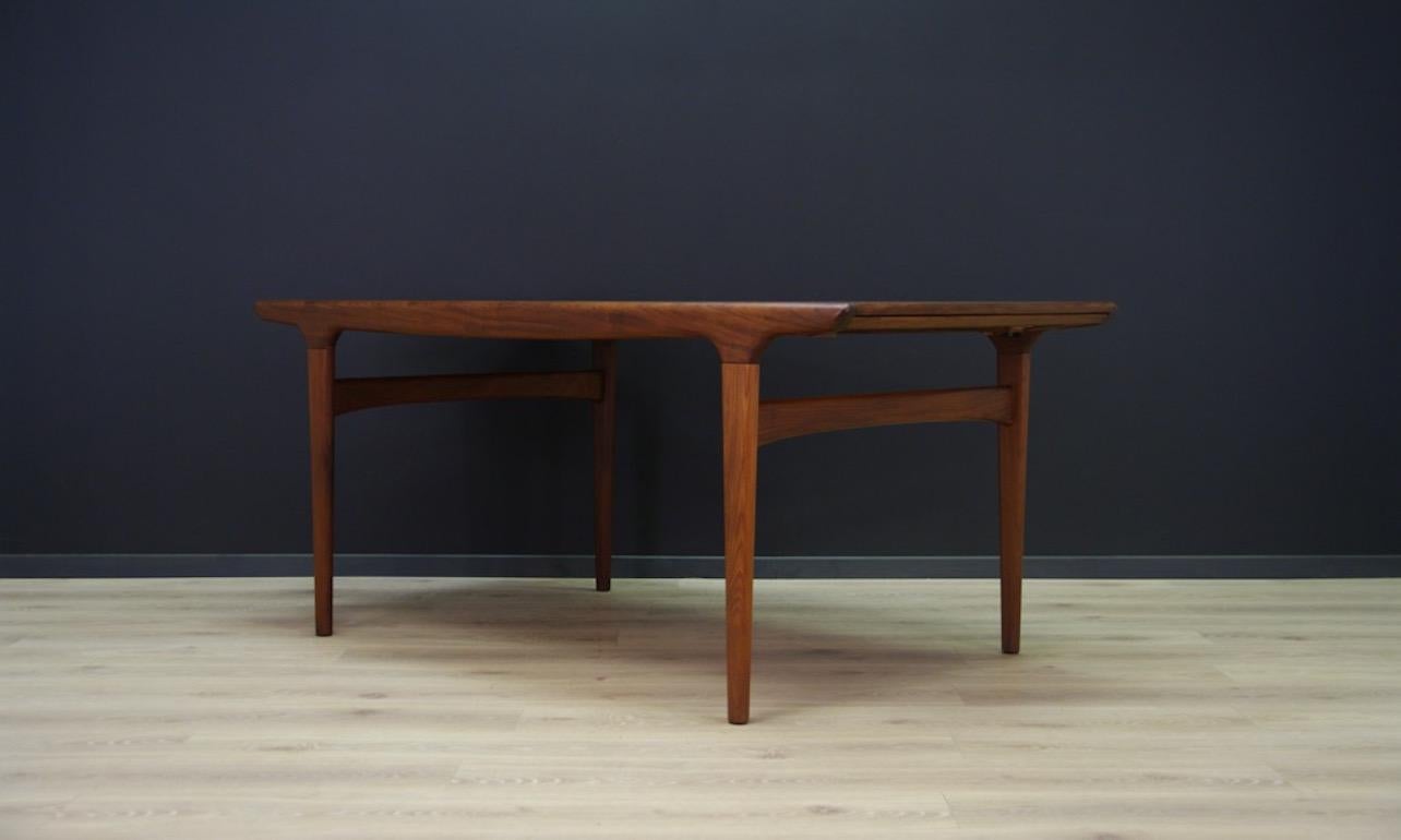Retro table from 1960s-1970s, Scandinavian design, Minimalist form designed by leading Danish designer Johannes Andersen, made in the Uldum Møbelfabrik manufacture. Table finished with teak veneer, legs made of teak wood. Preserved in good condition