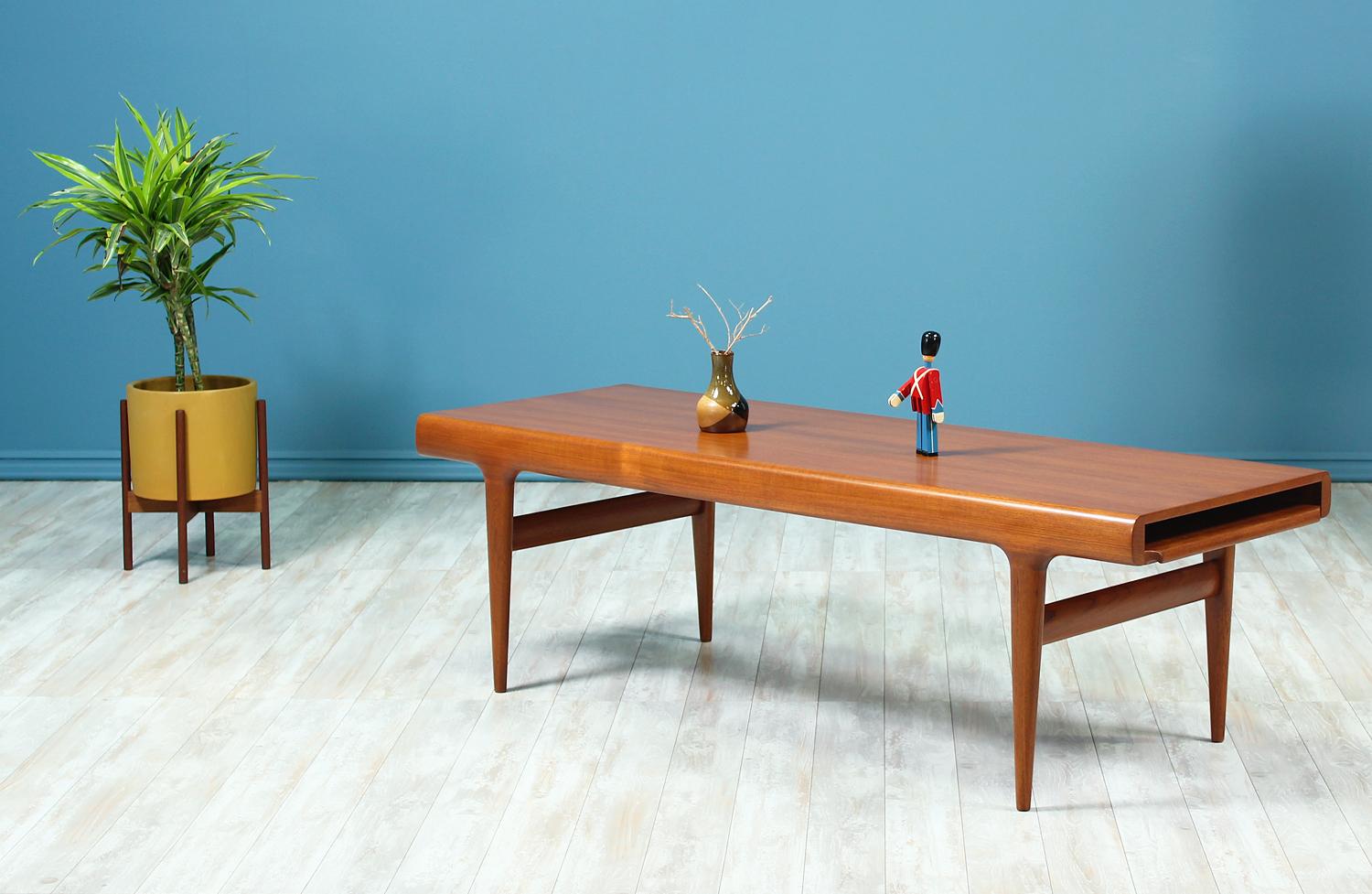 Designer: Johannes Andersen
Manufacturer: Uldum Mobelfabrik
Country of origin: Denmark
Date of manufacture: 1950-1959
Materials: Teak wood
Period style: Danish modern

Condition: Excellent
Extra conditions: Newly refinished
Dimensions: